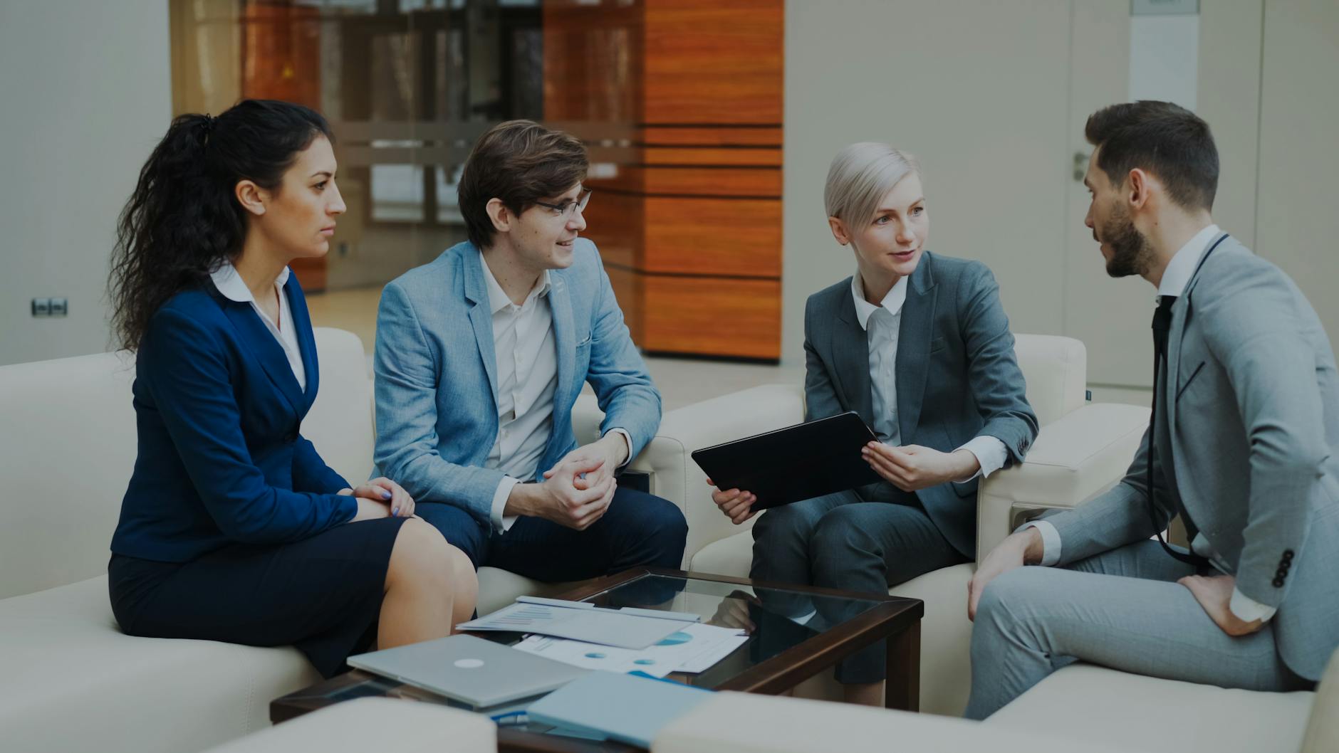 Professionals discussing strategy in an office