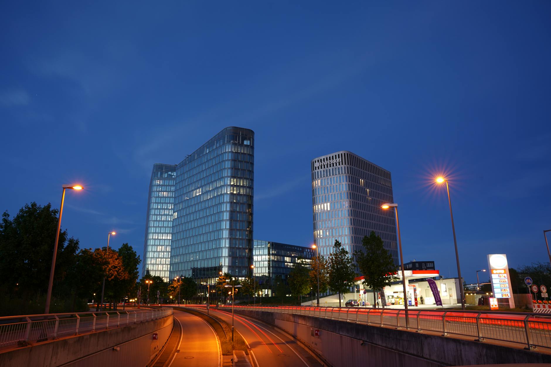Modern Munich cityscape with illuminated office buildings at dusk