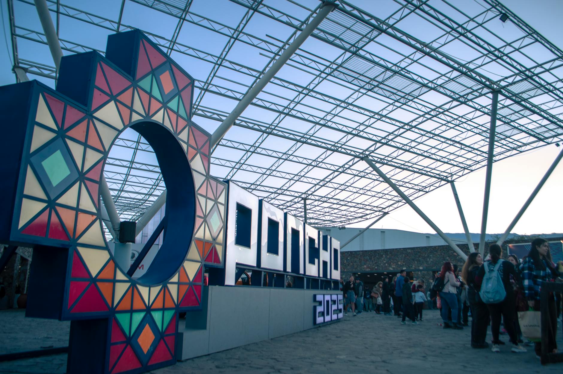 Expo signage with attendees gathering