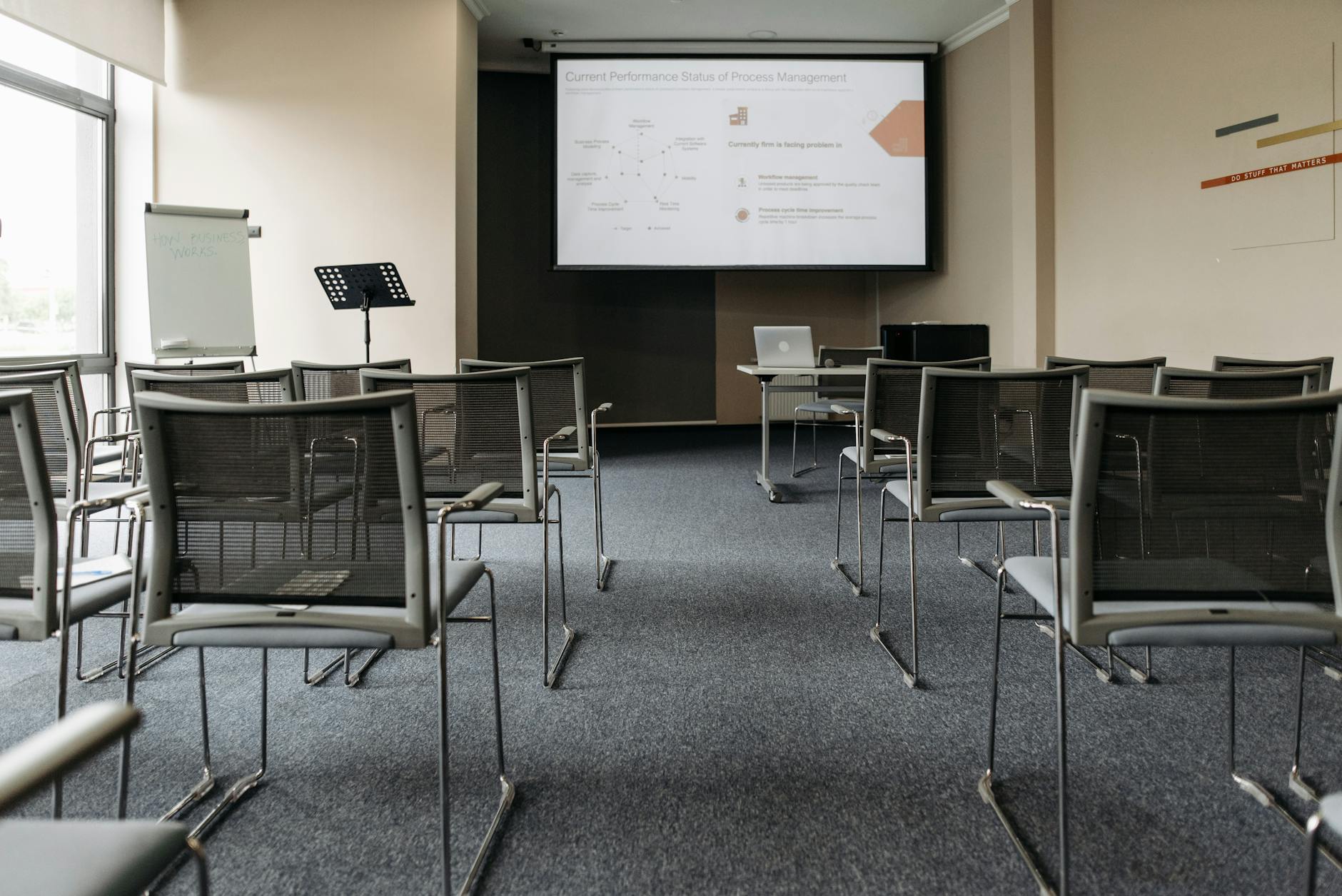 Conference room with projector screen and chairs