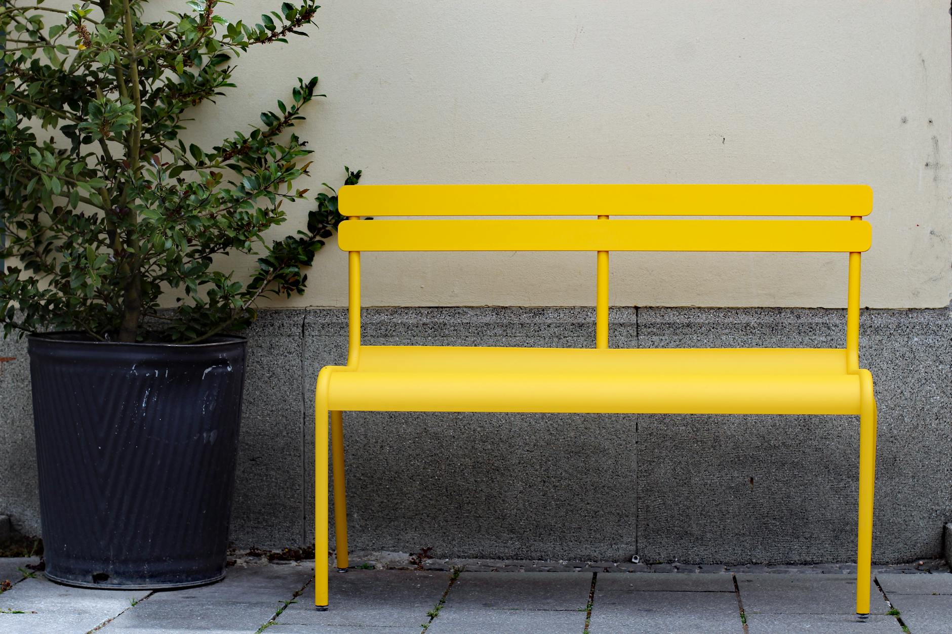Yellow bench against a wall in Munich