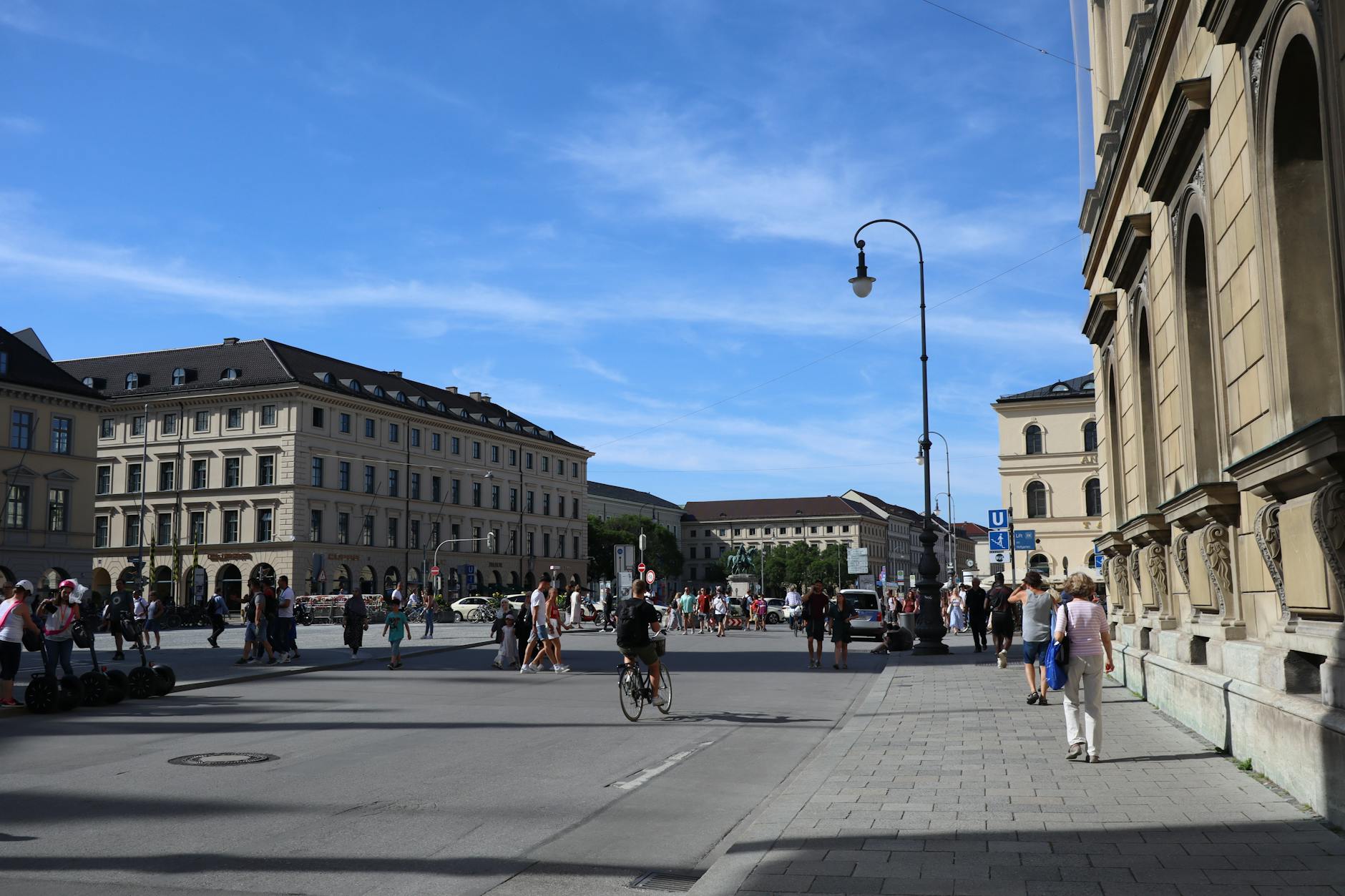 People walking and cycling at Odeonsplatz in Munich