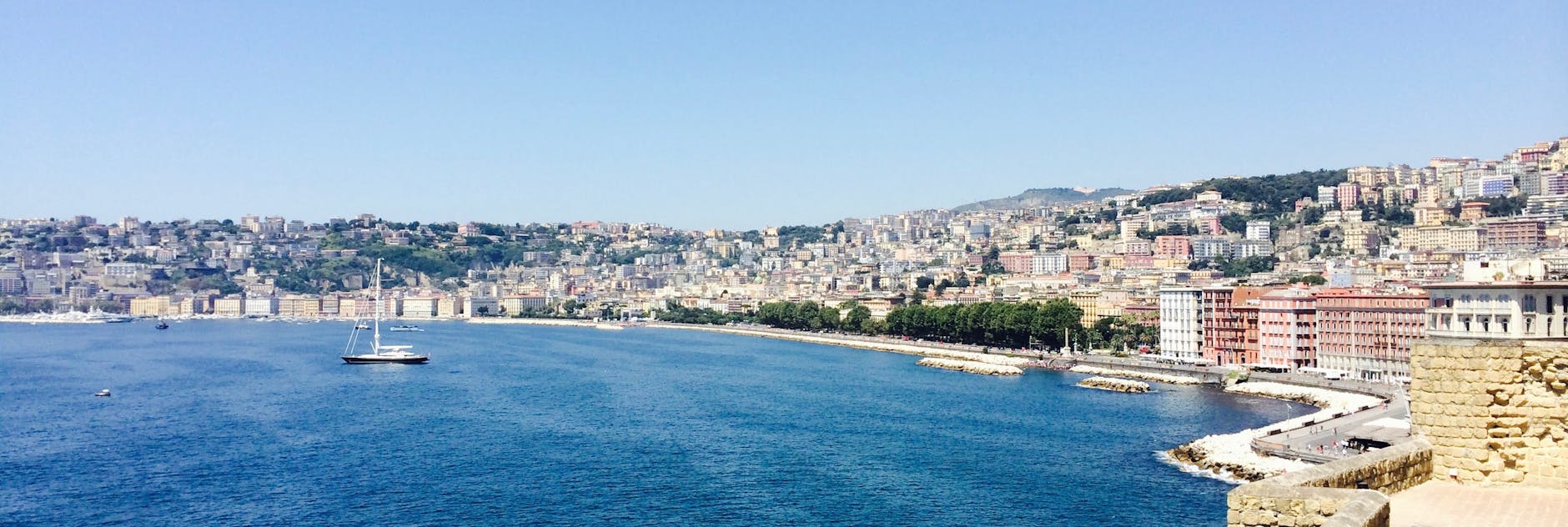 Panoramic view of Naples coastline with sailboats
