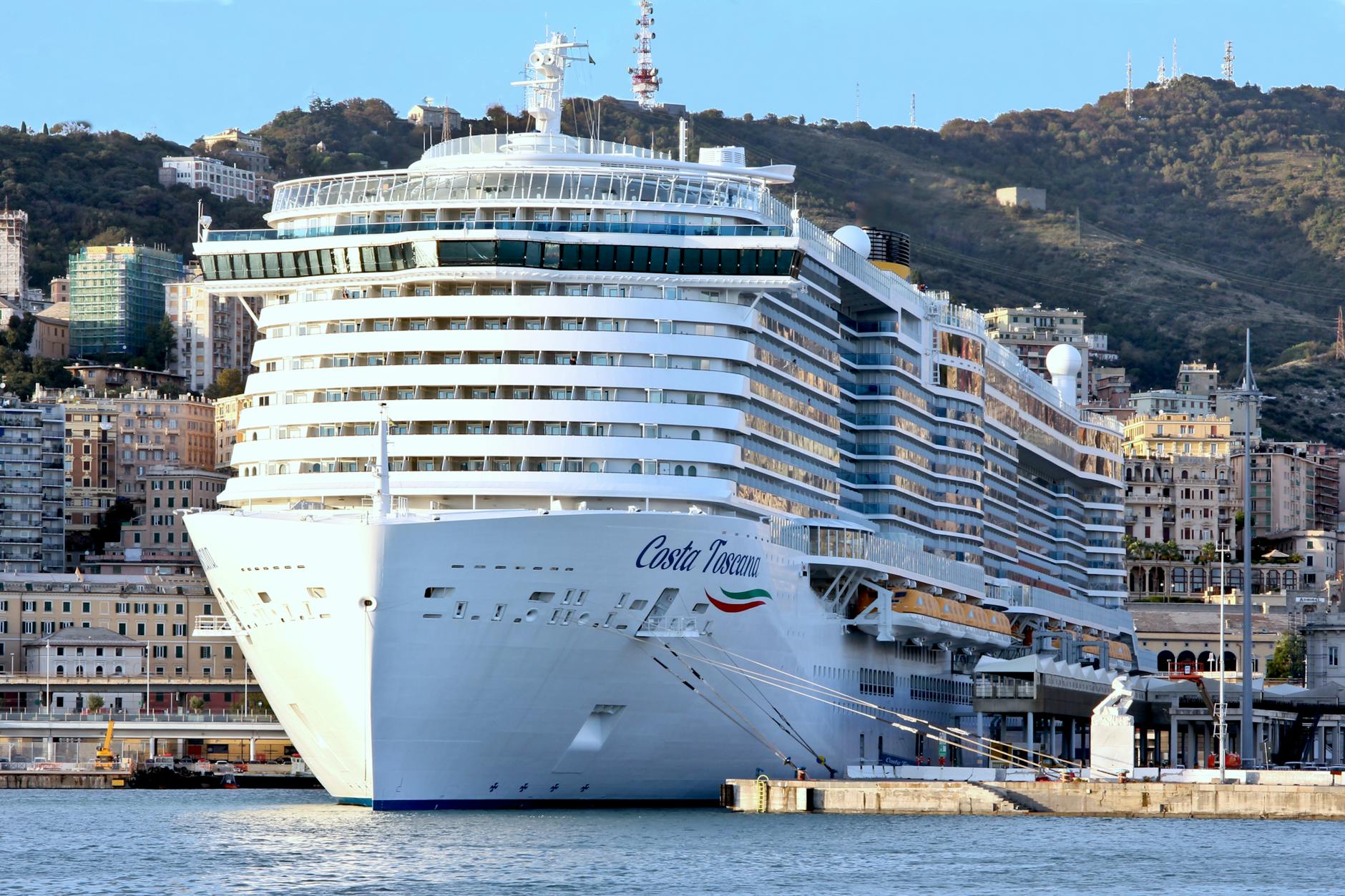 Cruise ship docked in an urban harbor