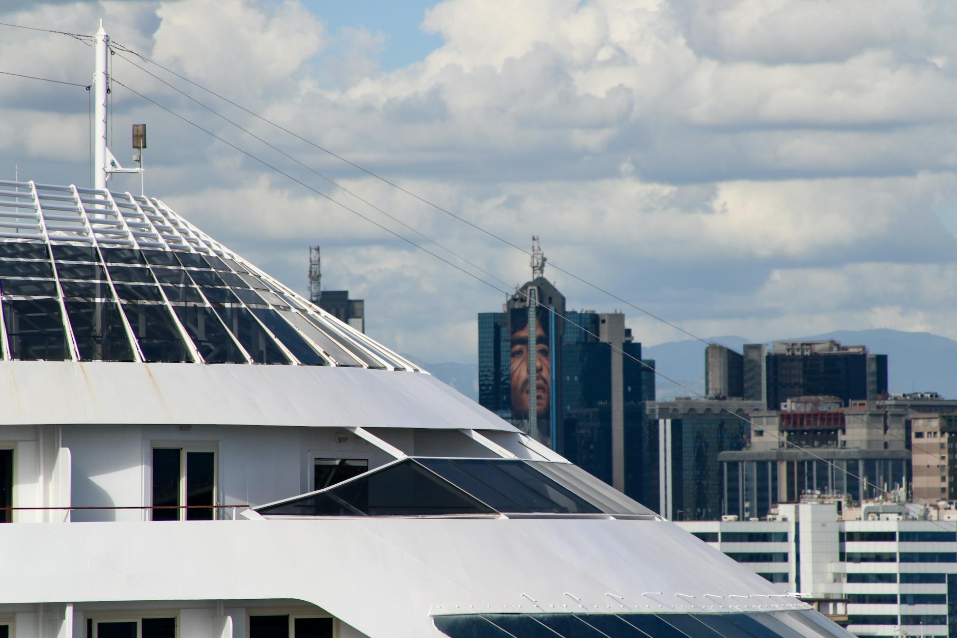 Cruise ship with the Napoli skyline behind it