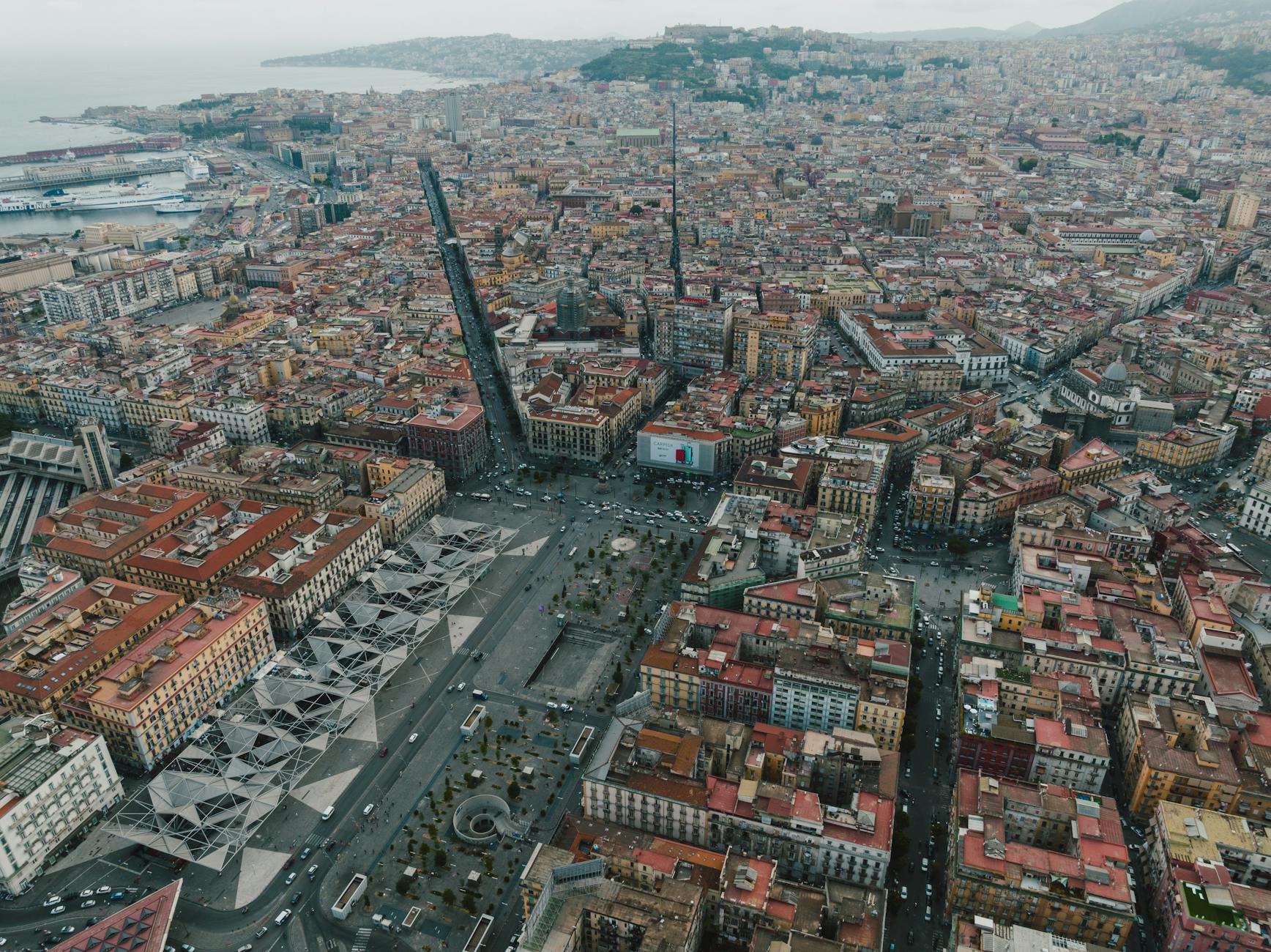 Dense urban landscape and coastline in Naples