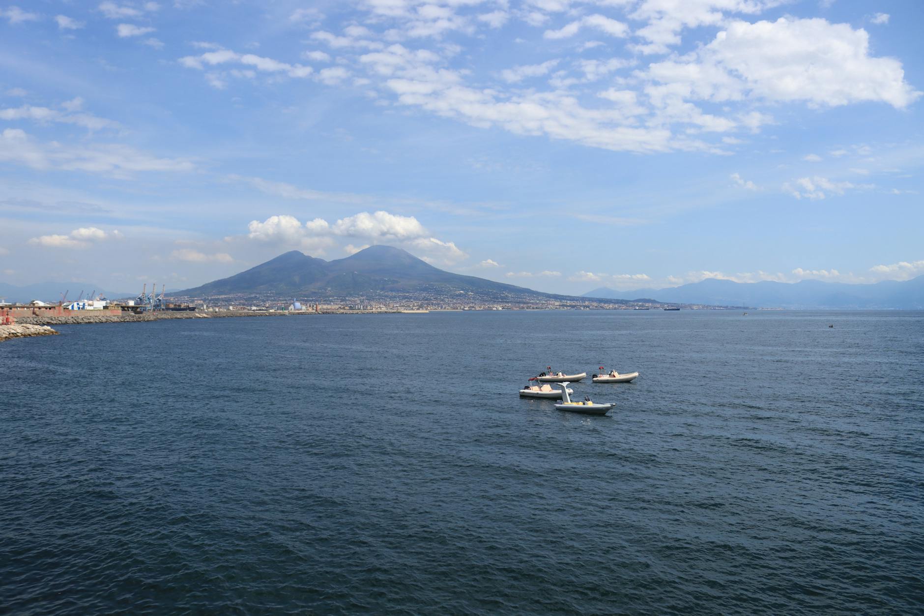 Aerial view of boats on the Bay of Naples with Mount Vesuvius