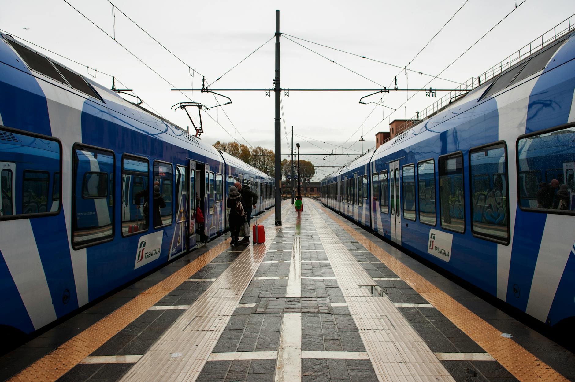 Trenitalia trains at an Italian railway platform