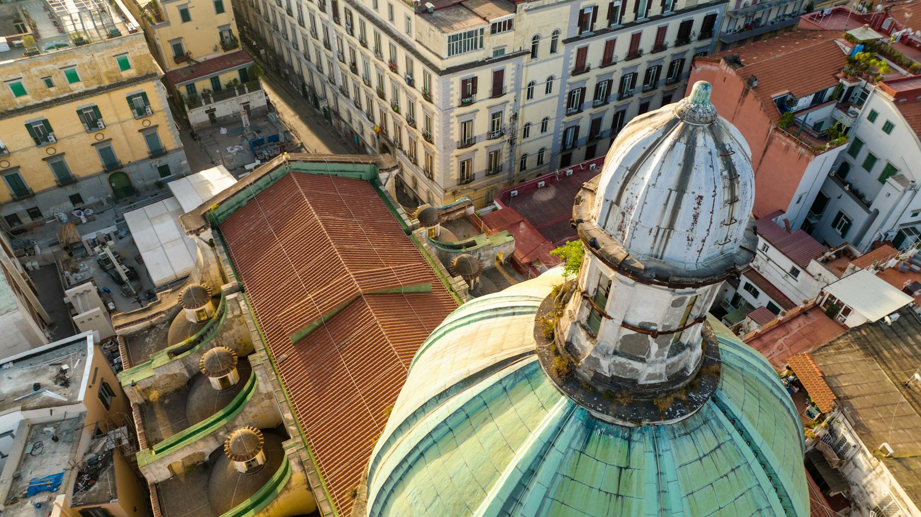 Historic church dome among Naples rooftops