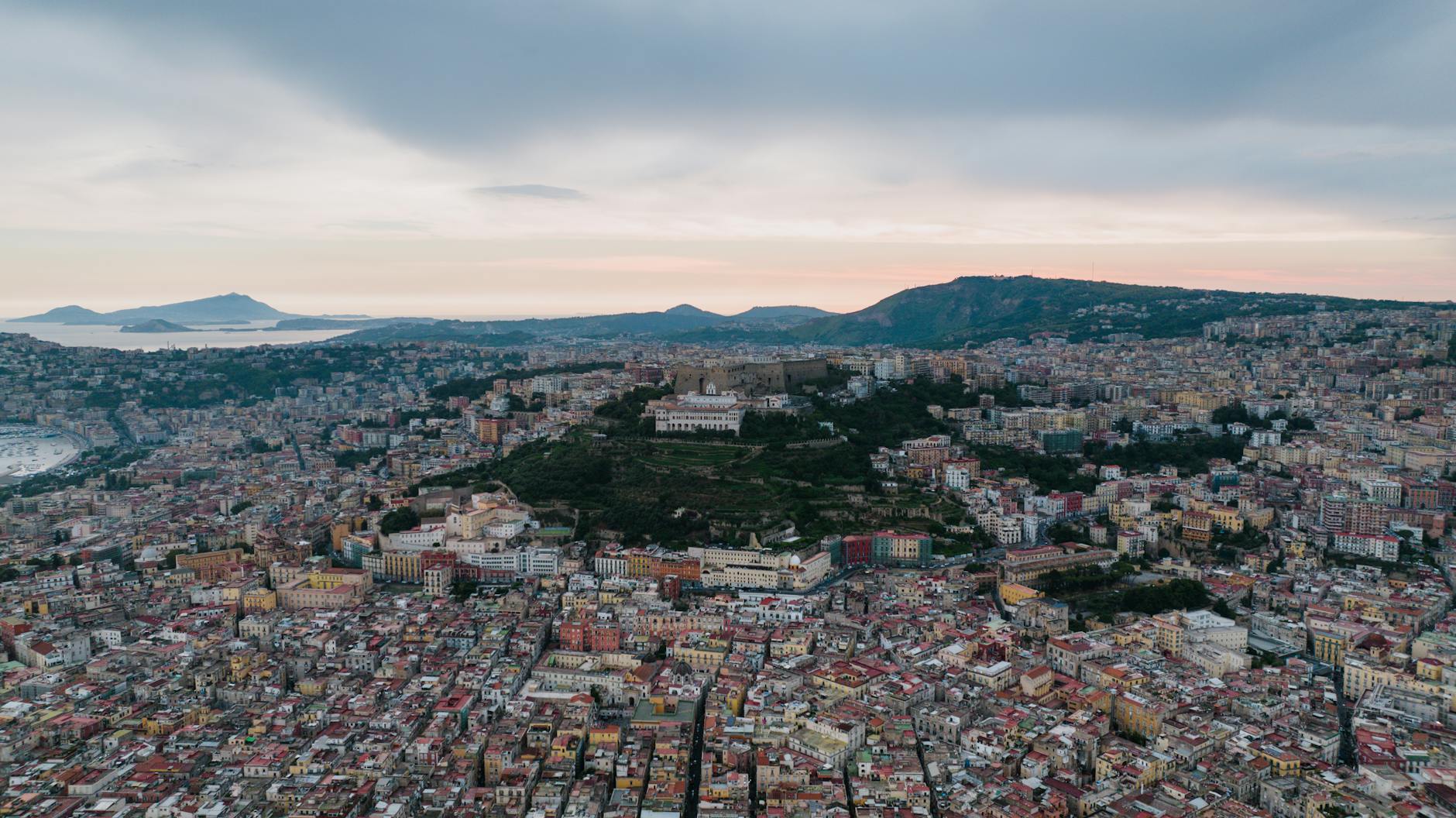 Aerial view of Naples buildings and surrounding hills