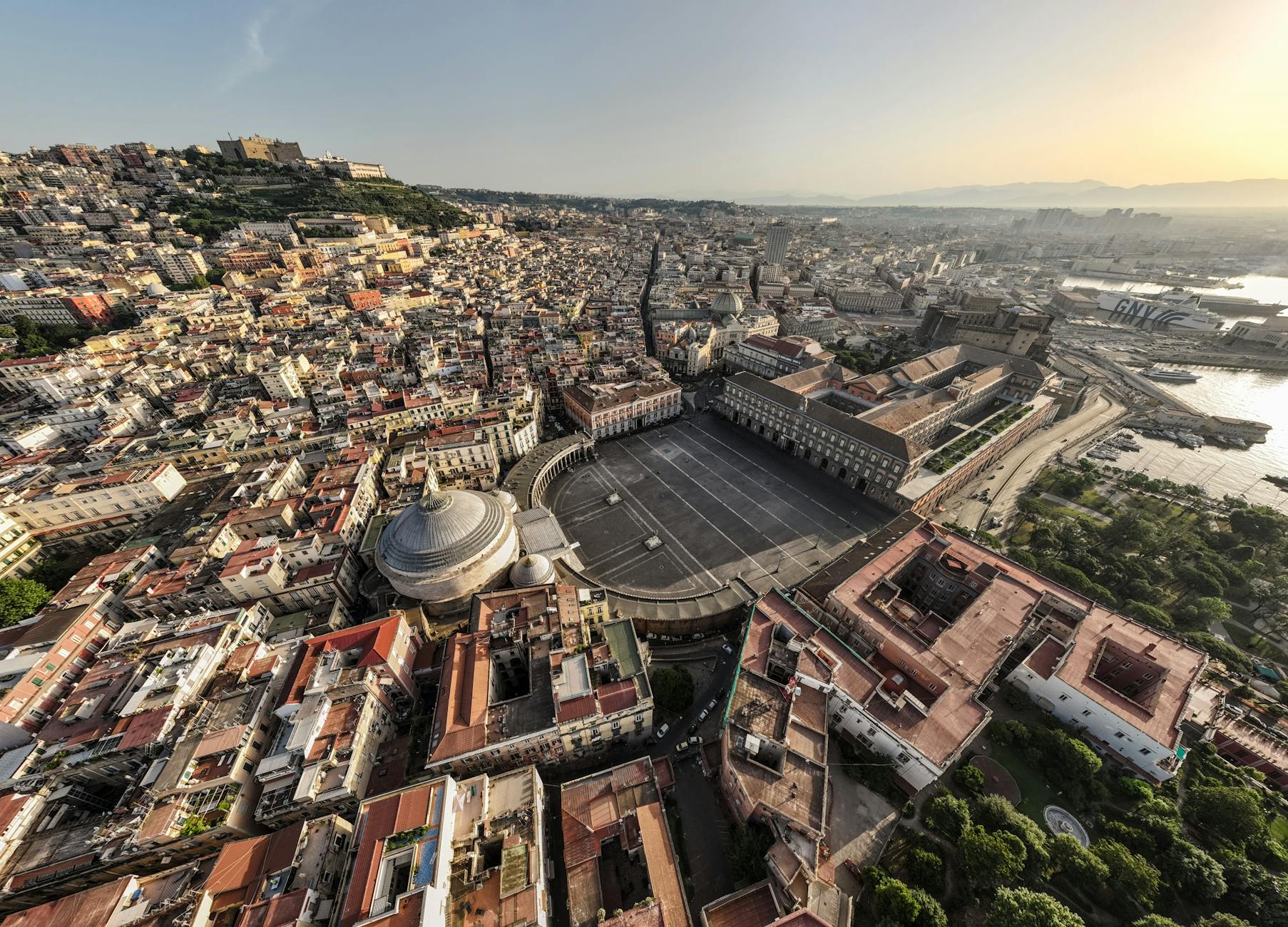 Piazza del Plebiscito and Naples at sunset
