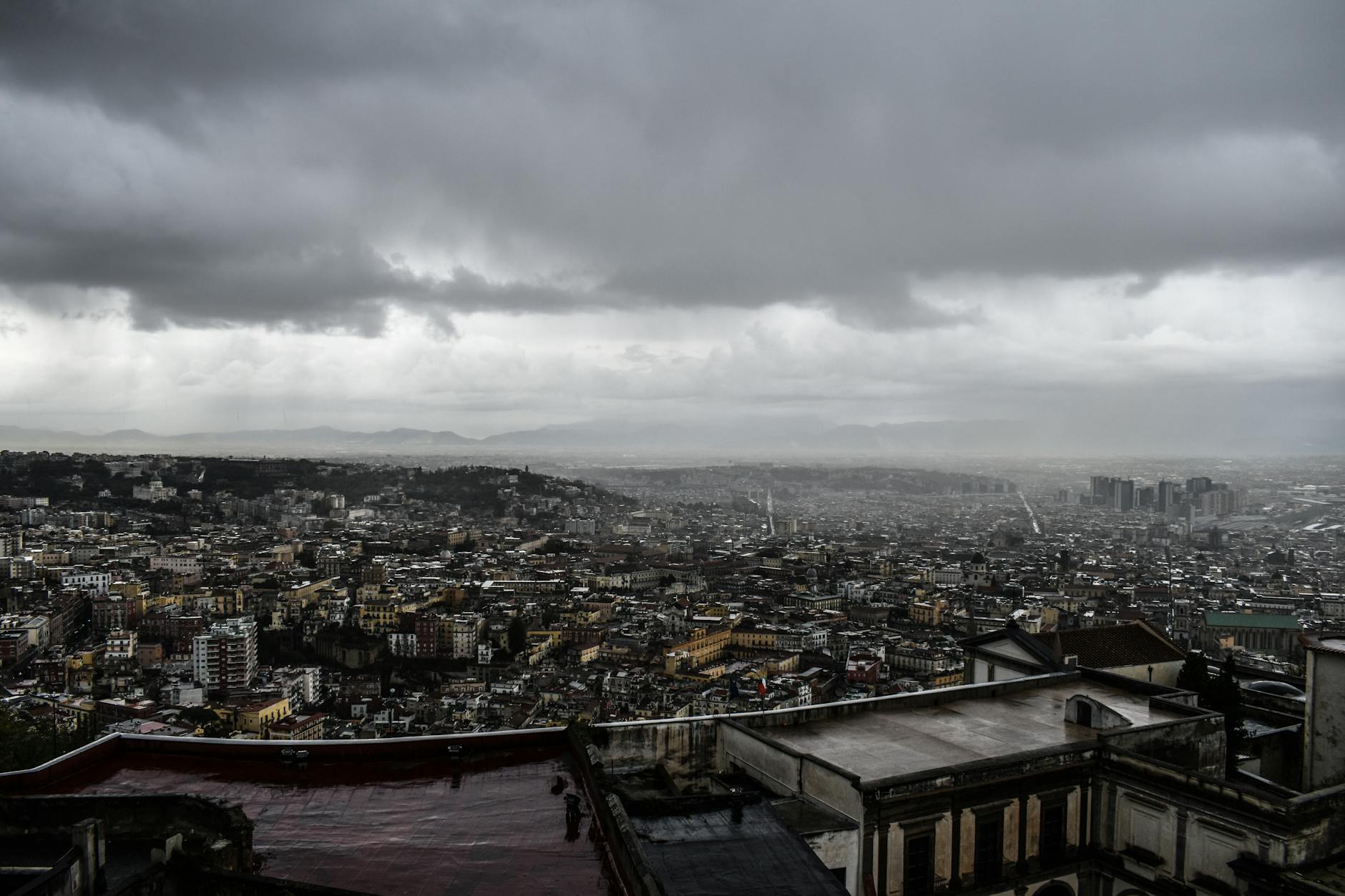 Cloudy Naples urban landscape and hillside buildings