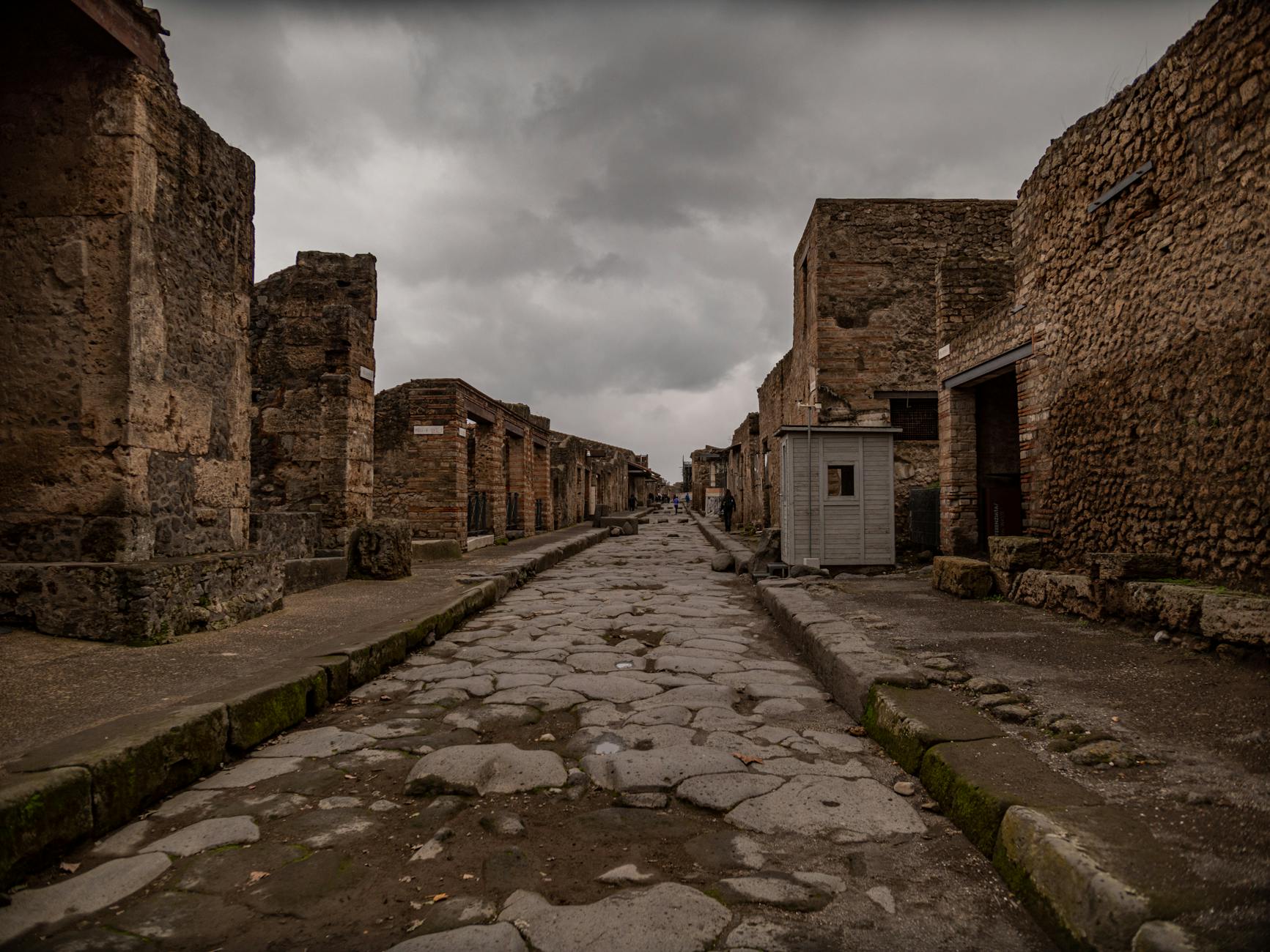 Ancient street in Pompeii under an overcast sky