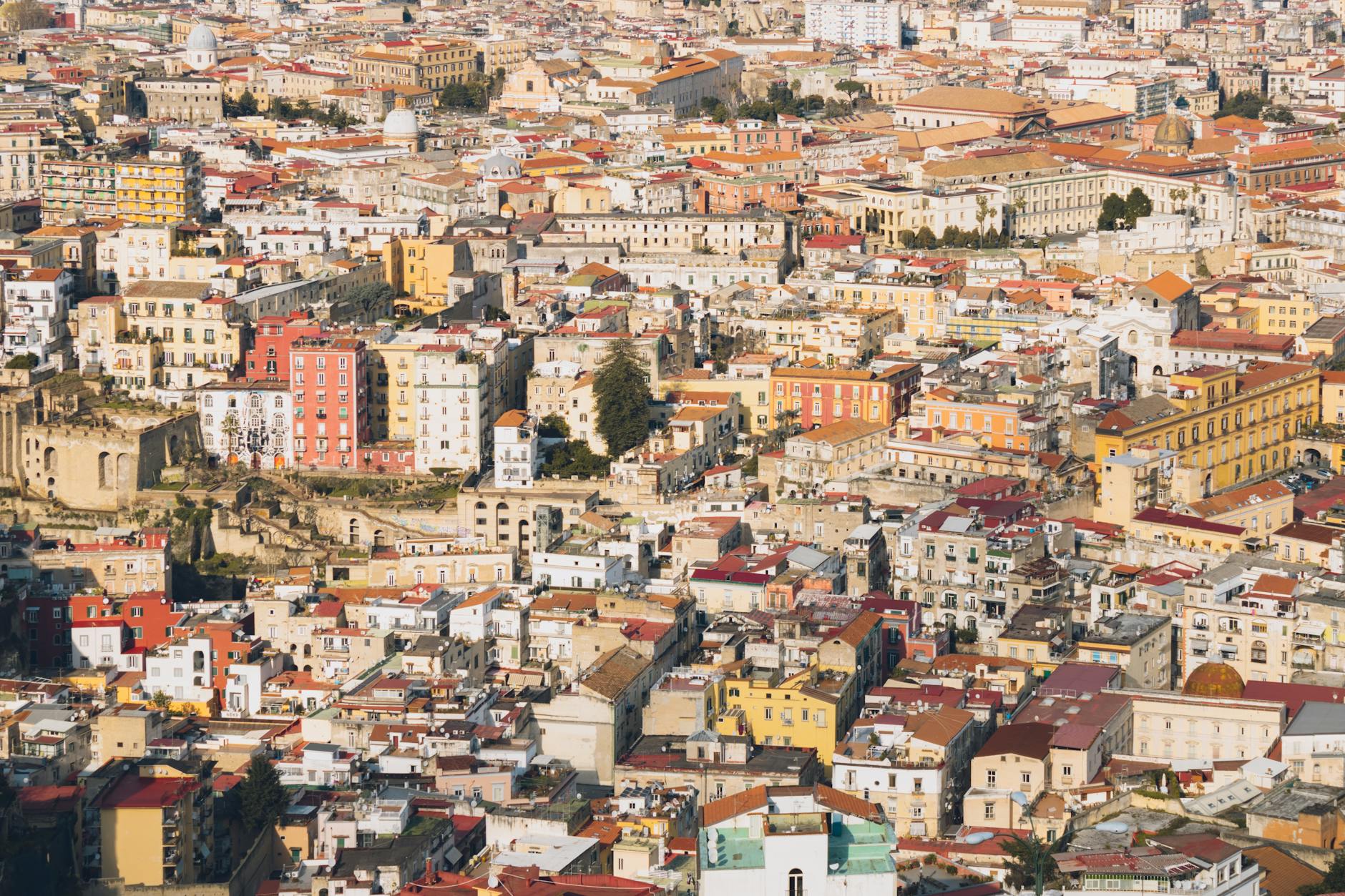 Dense Naples rooftops and colorful buildings from above