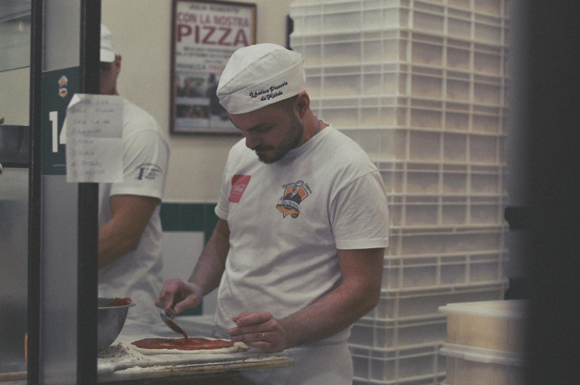 Pizza being prepared in a Napoli restaurant kitchen