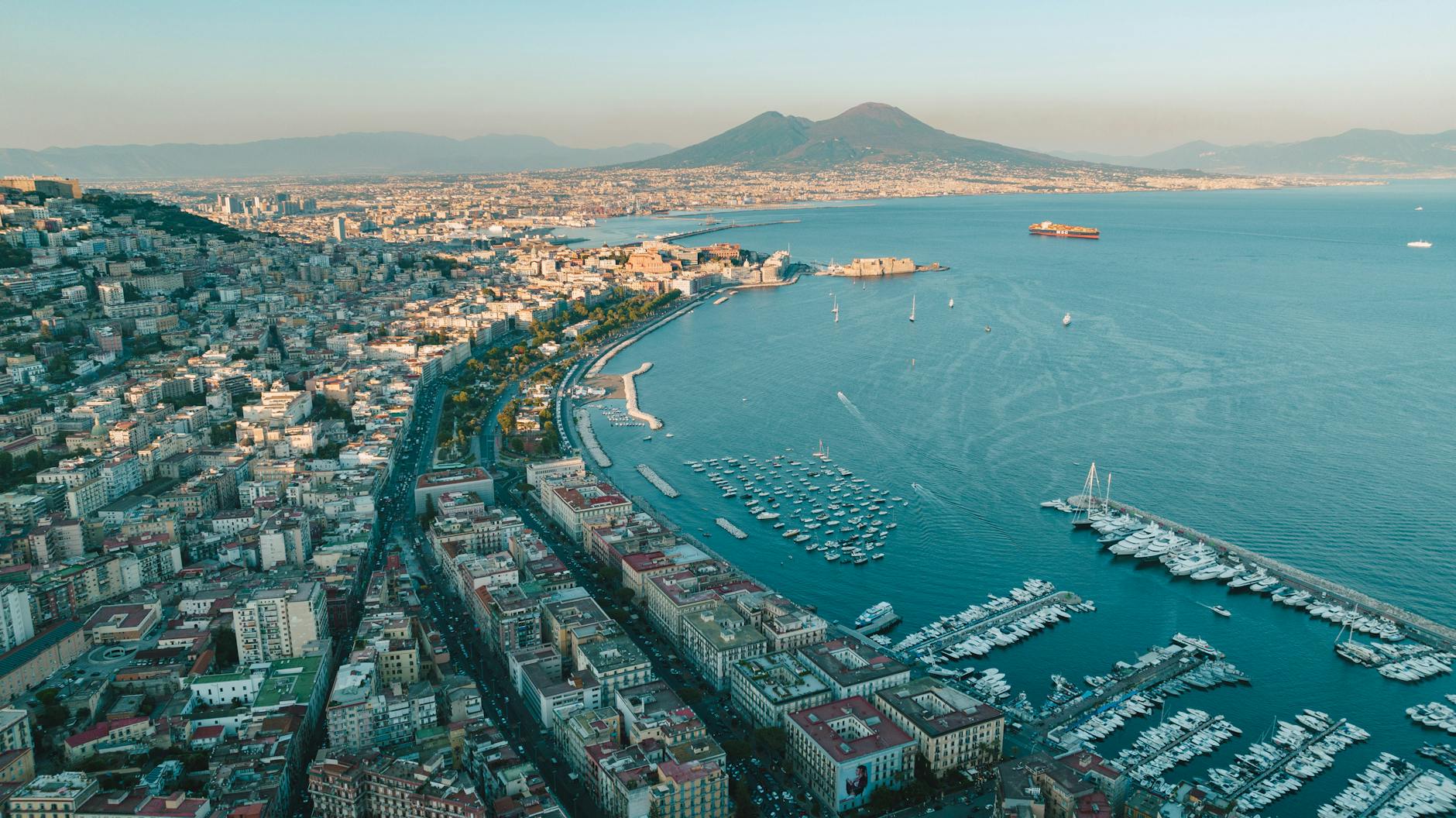 Naples harbor and Mount Vesuvius at sunset