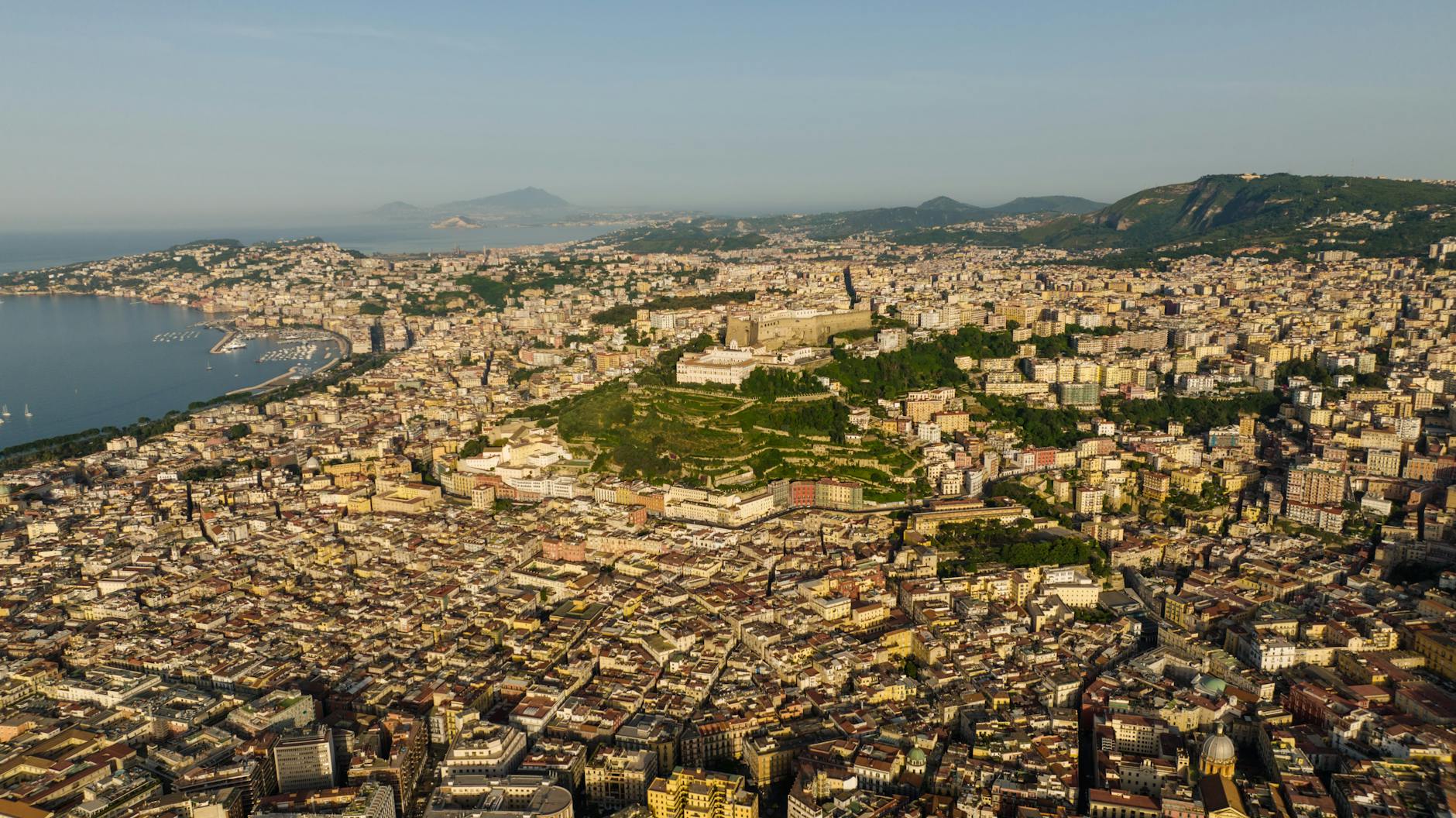 Naples cityscape with Mount Vesuvius in the background