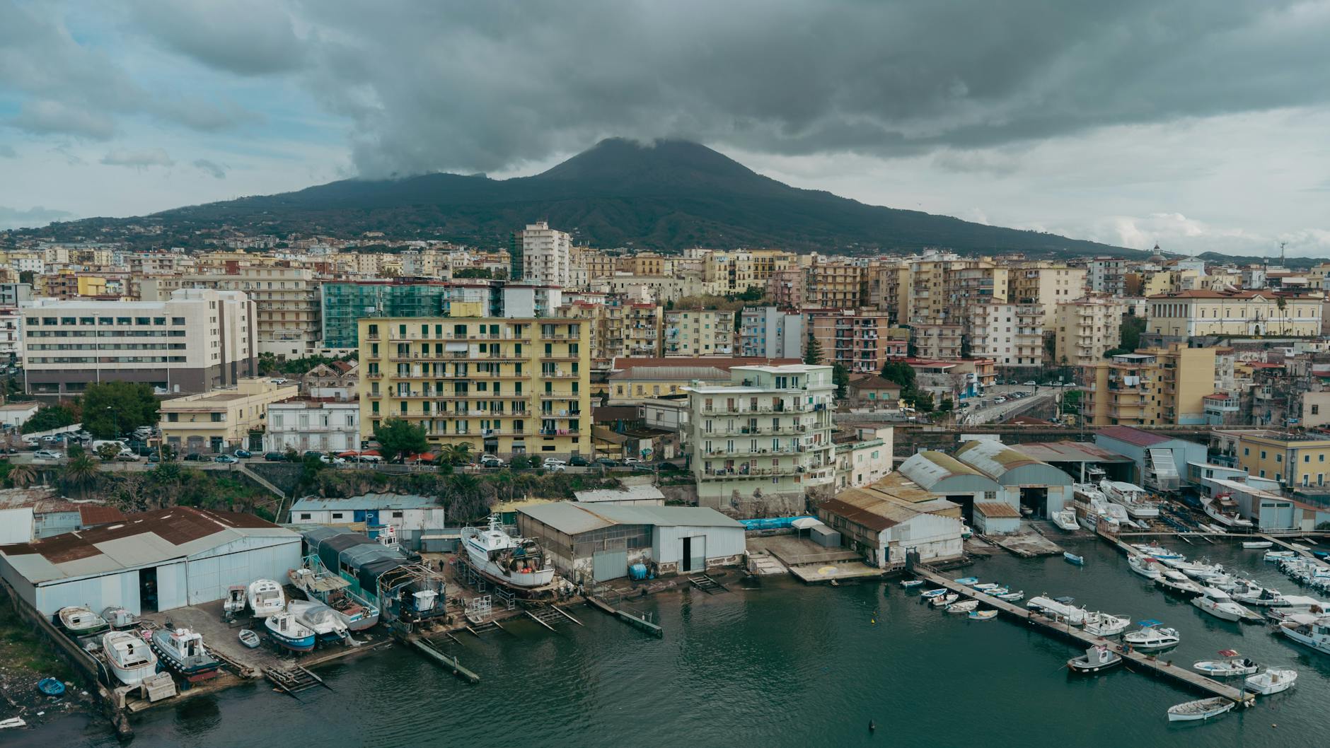Aerial view of Naples with Mount Vesuvius under cloudy skies