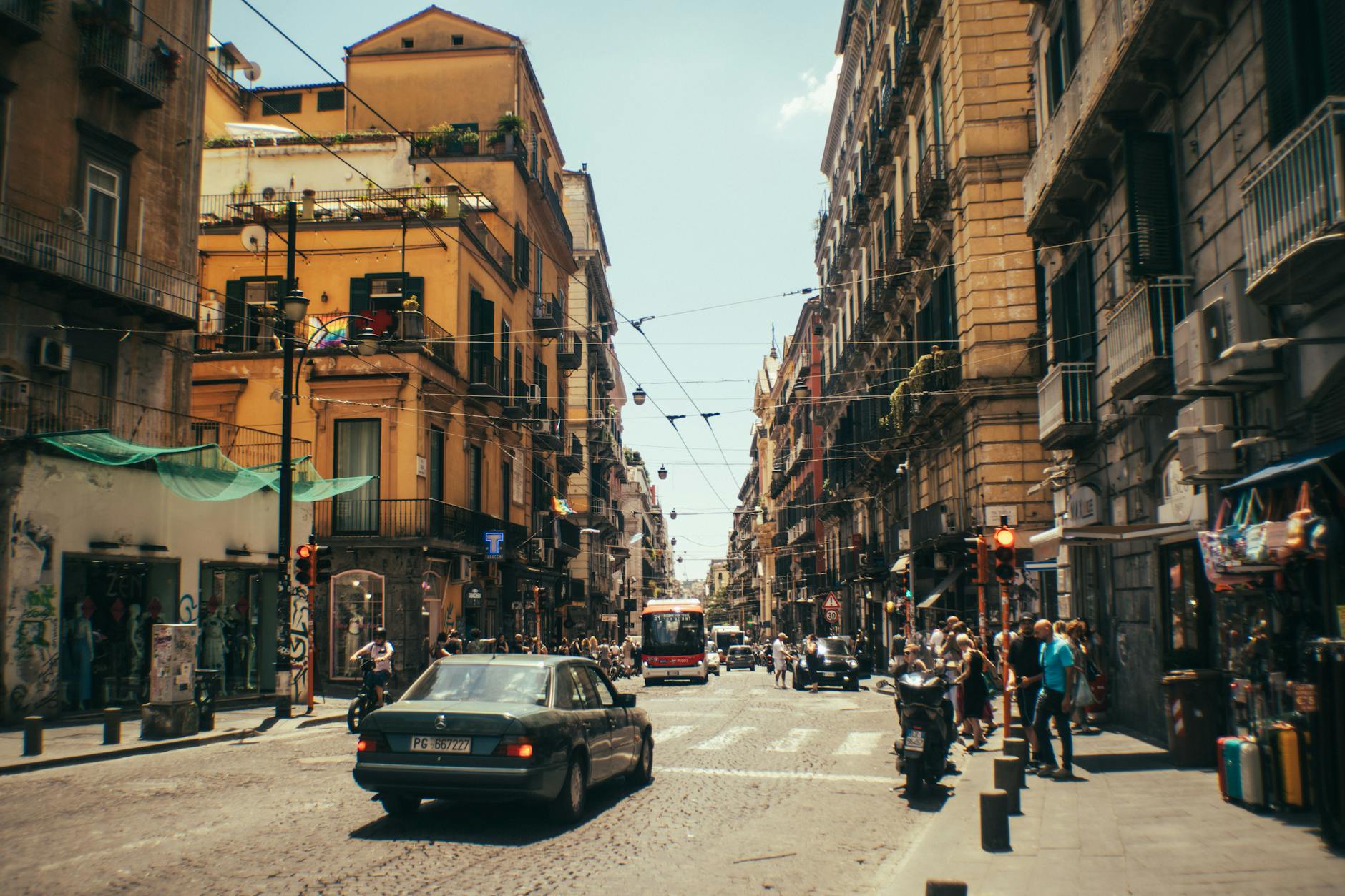 Busy European street scene with pedestrians and classic architecture