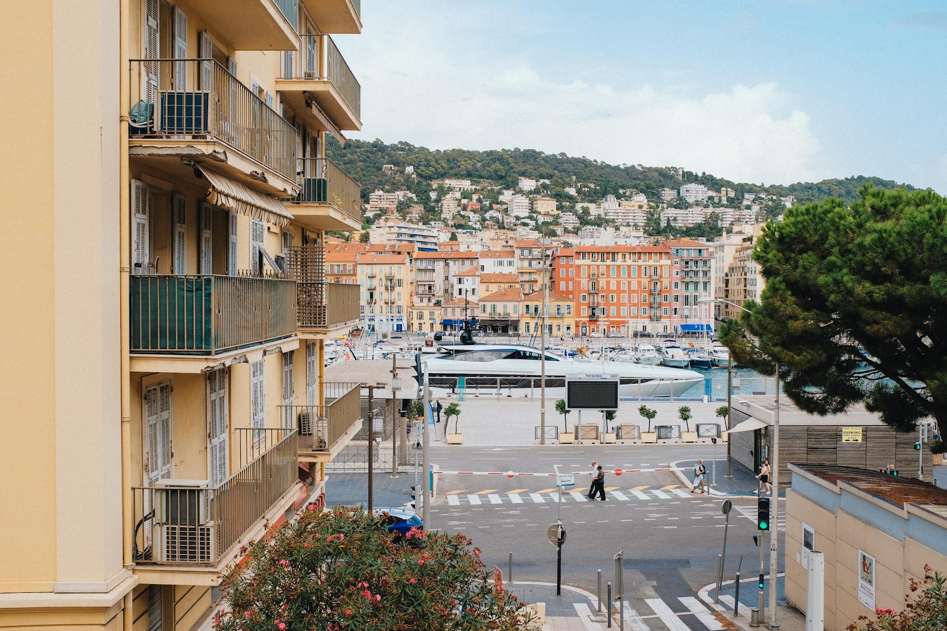 View over Nice harbor, hillside architecture, and the Mediterranean