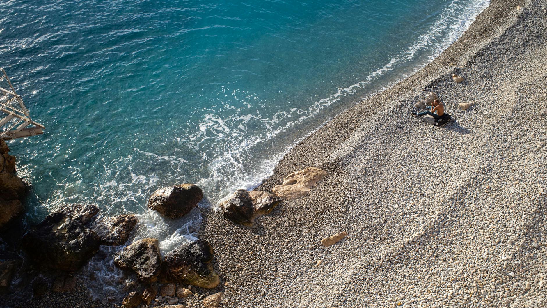 Rocky beach and clear blue water near Nice