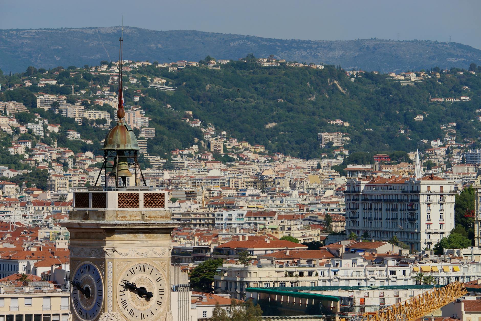 Historic clock tower with Nice cityscape in the background
