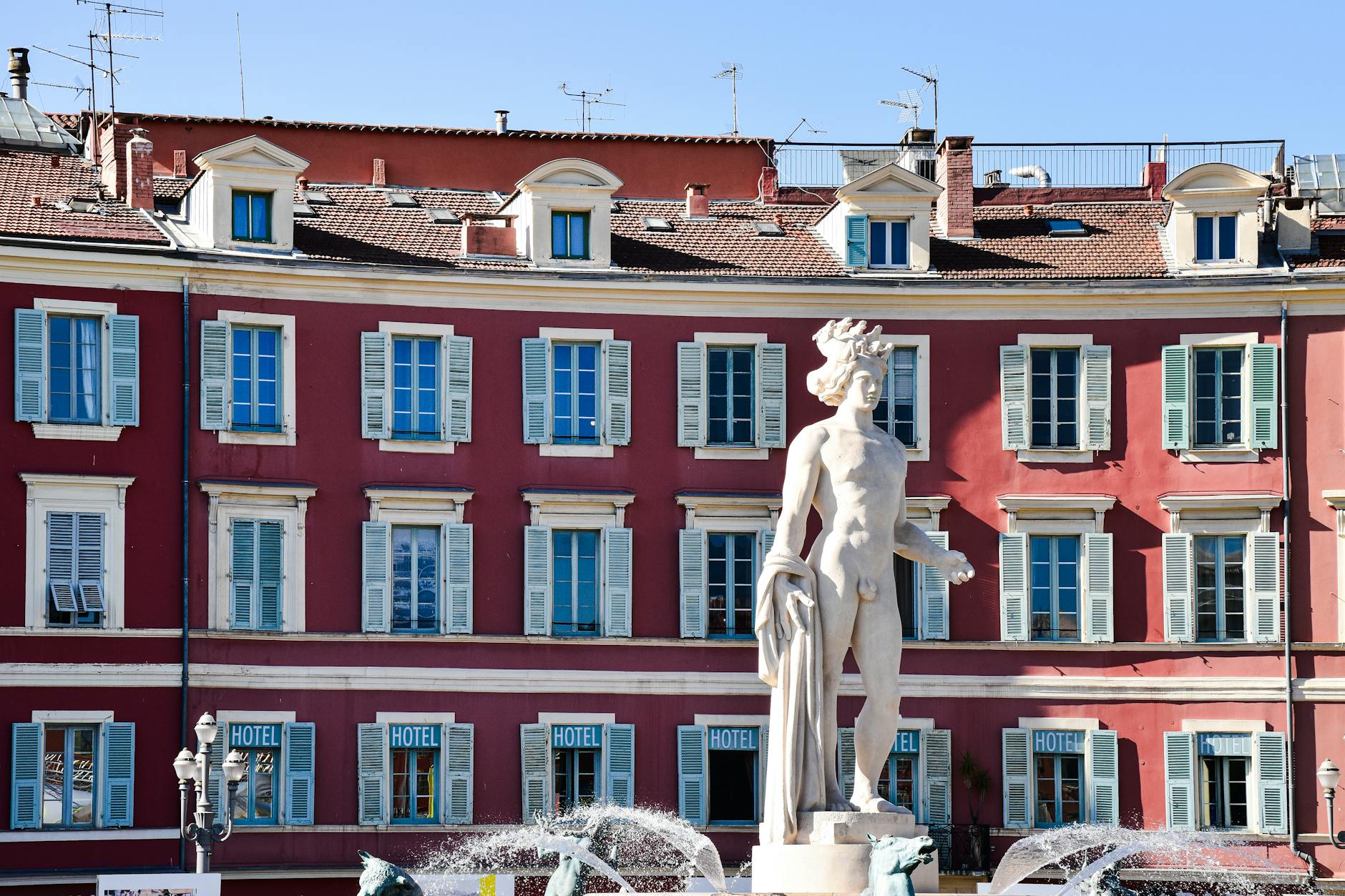 Neoclassical fountain and historic architecture in Nice