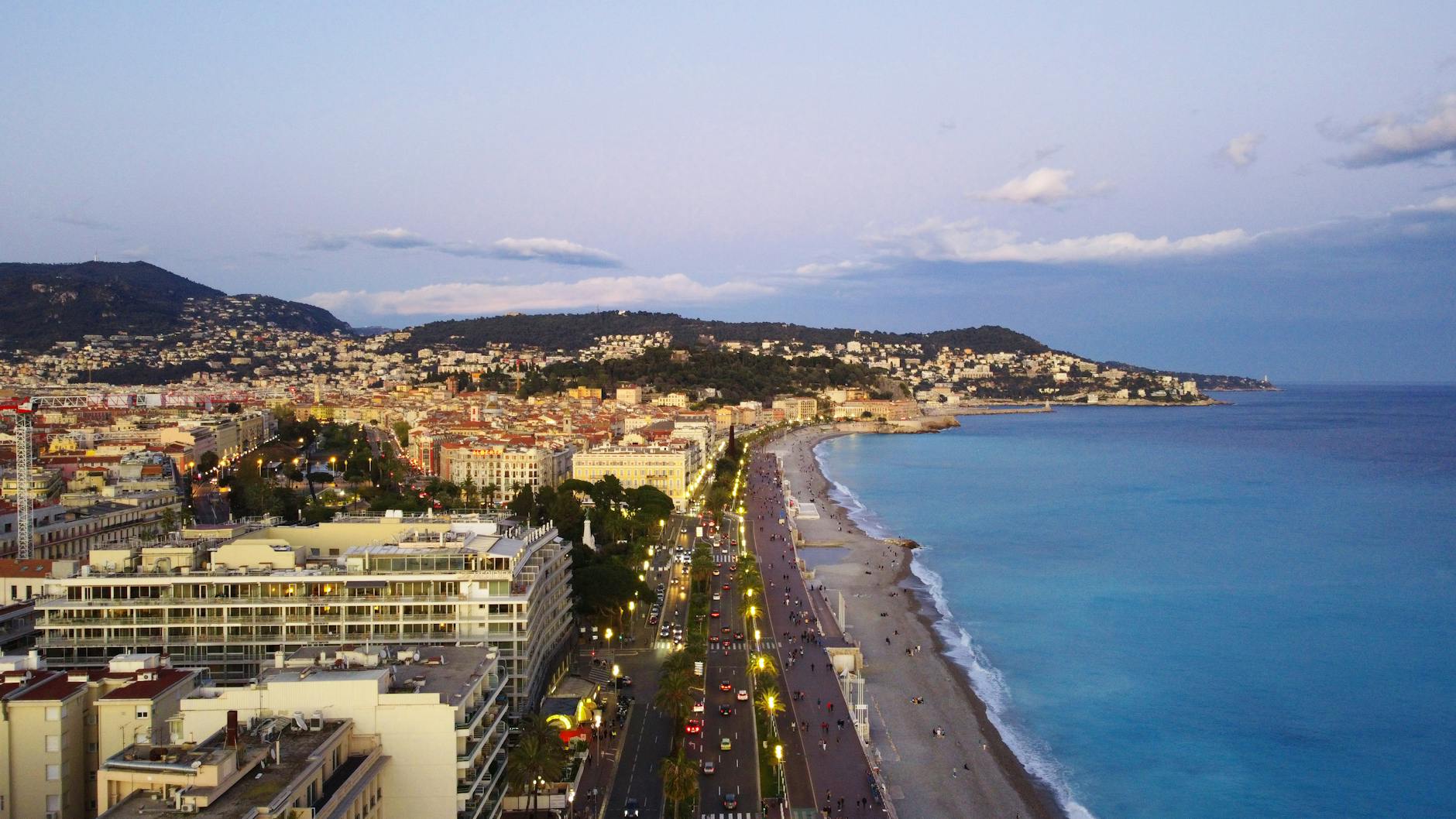 Aerial view of Nice coastline and cityscape at dusk