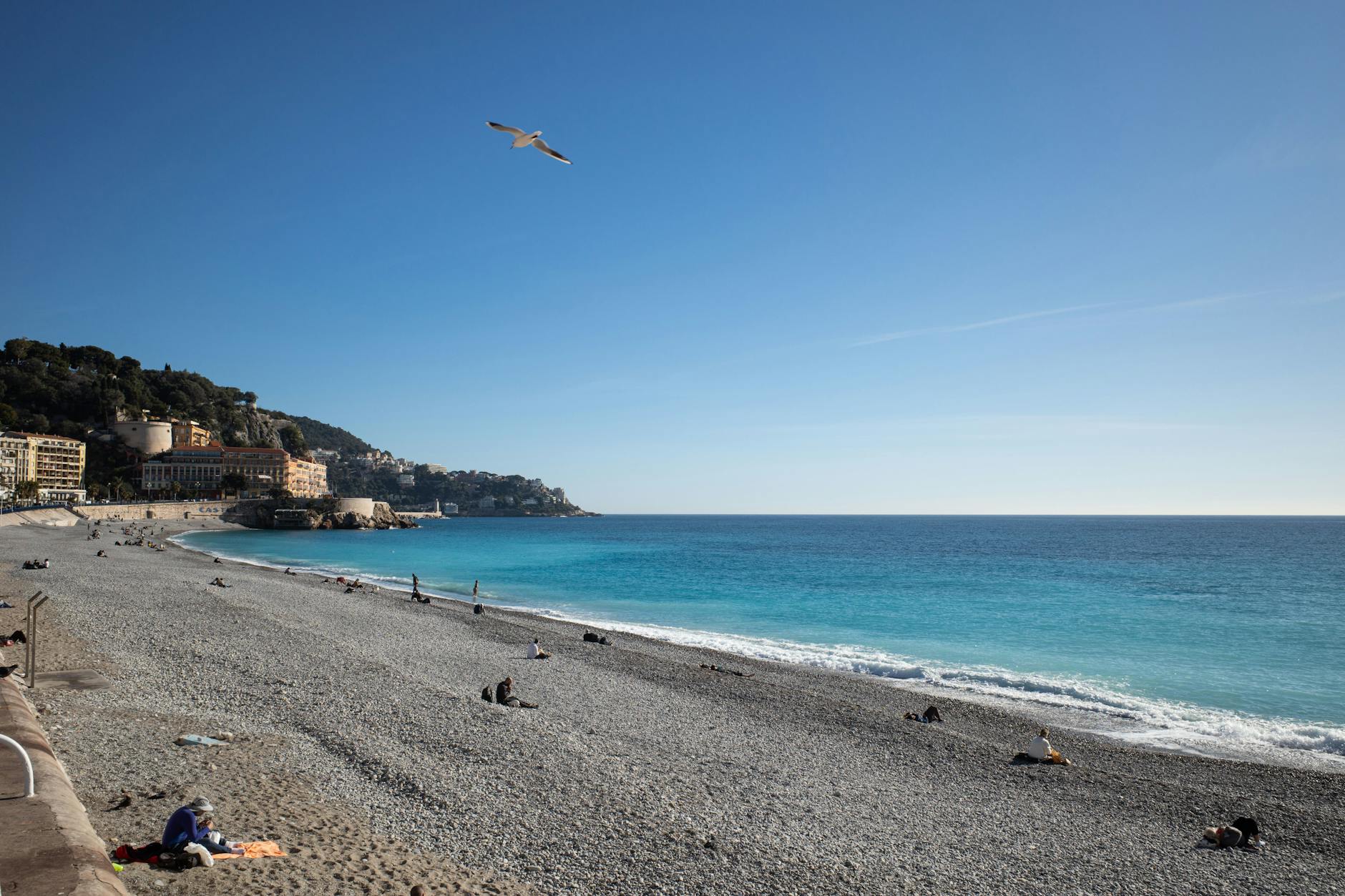 Beach and blue water in Nice on a clear day