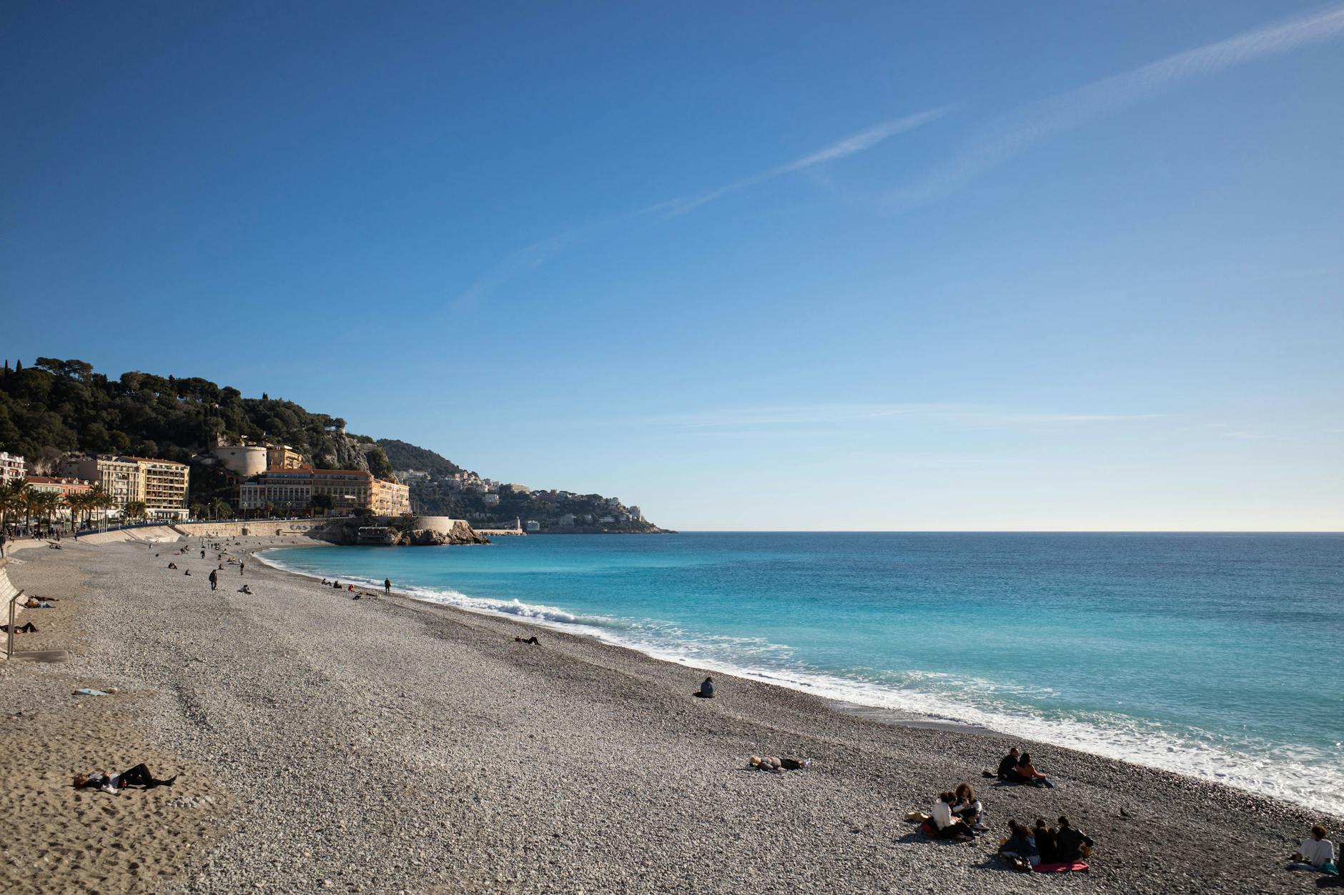Lively beach scene along the Nice coastline