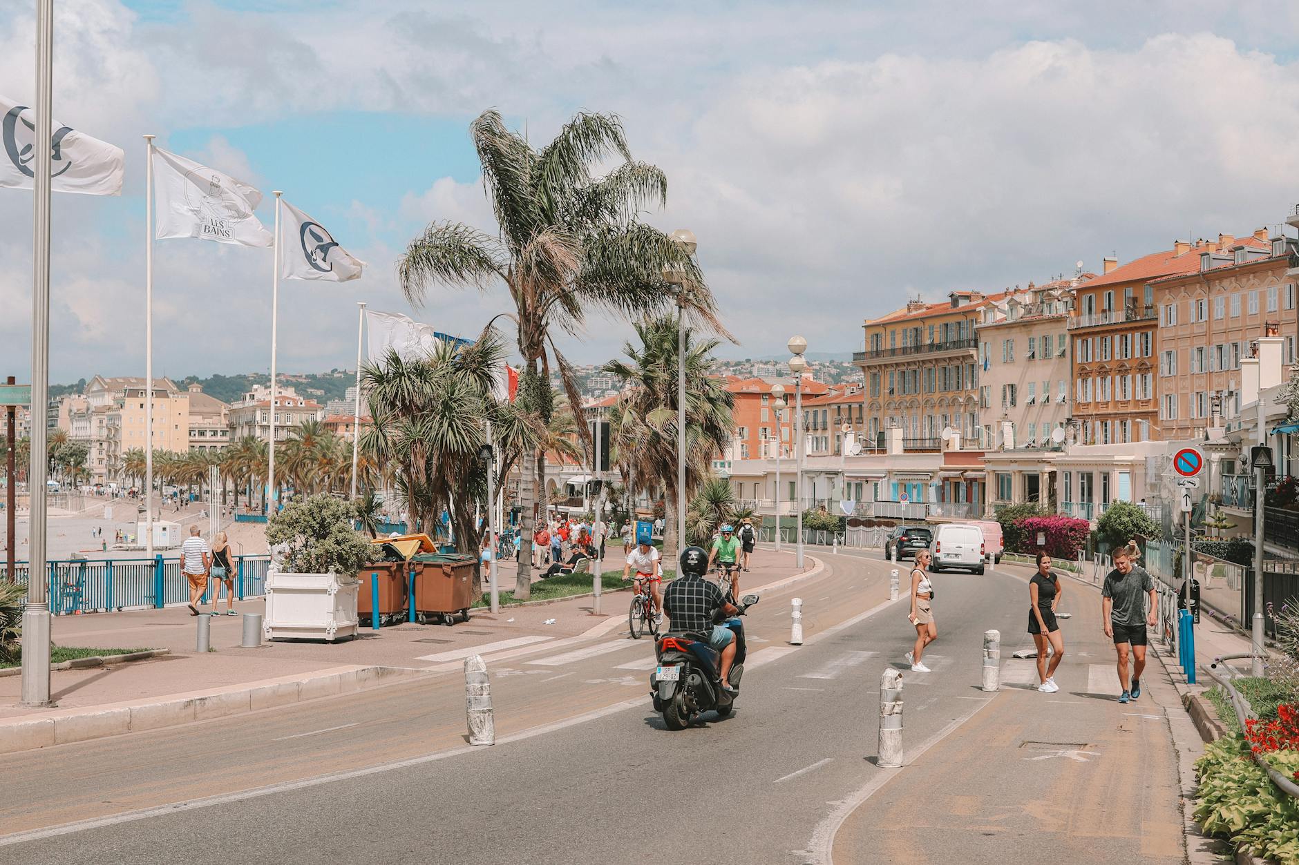 Pedestrians and scooters on the Promenade des Anglais