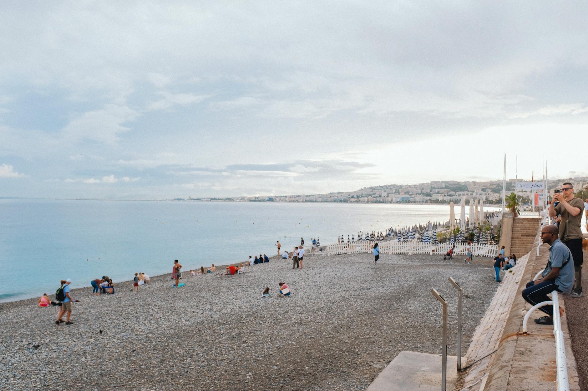 People relaxing on the beach along the Nice coast