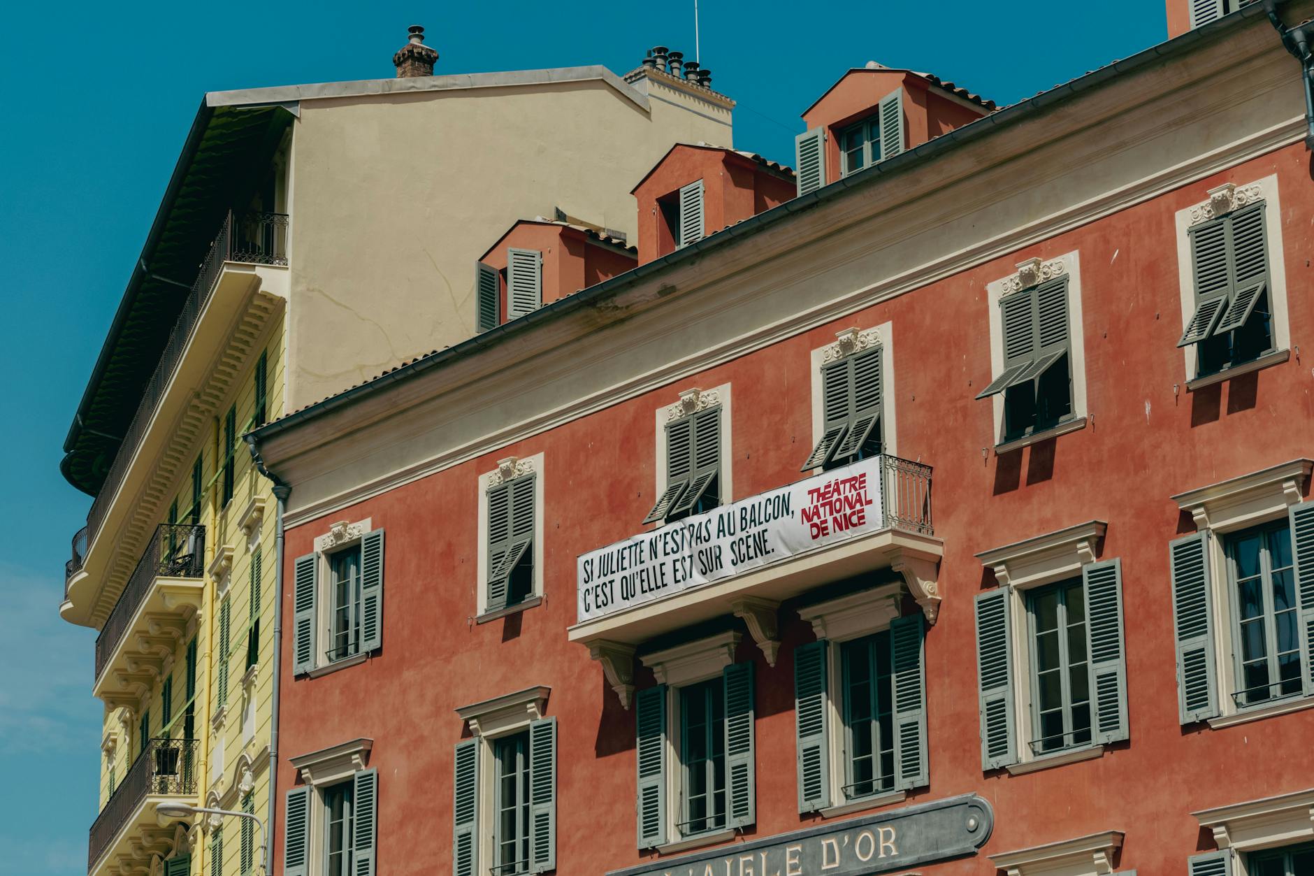 Historic buildings in Nice with colorful facades and balconies