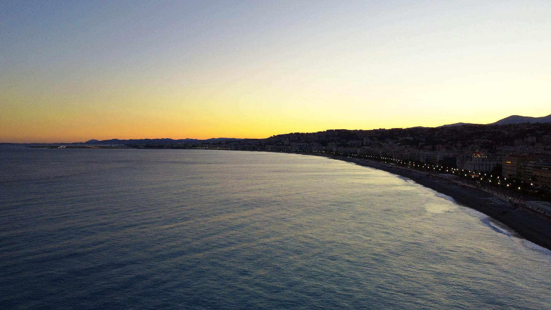 Sunset view over the coastal city of Nice and the sea