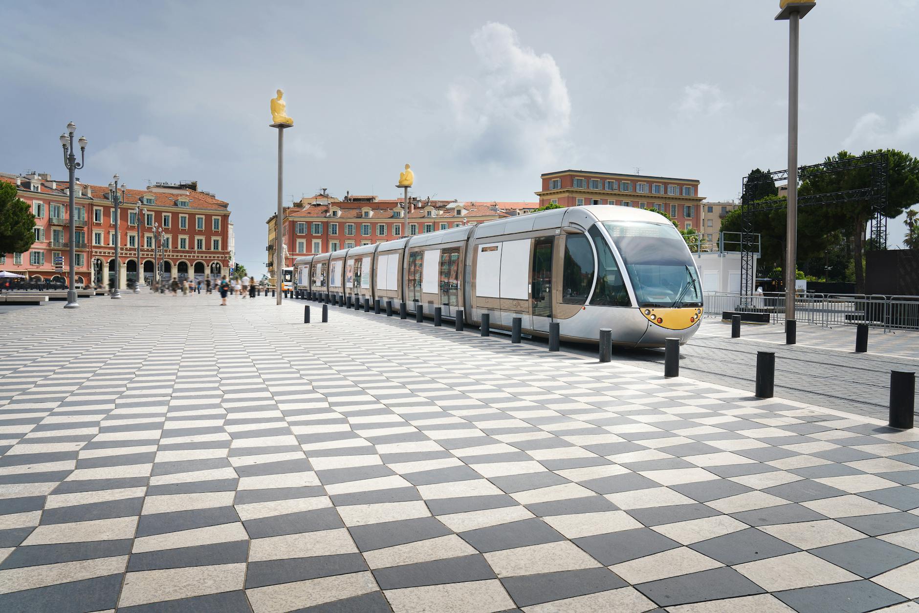 Modern tram moving through Nice city streets