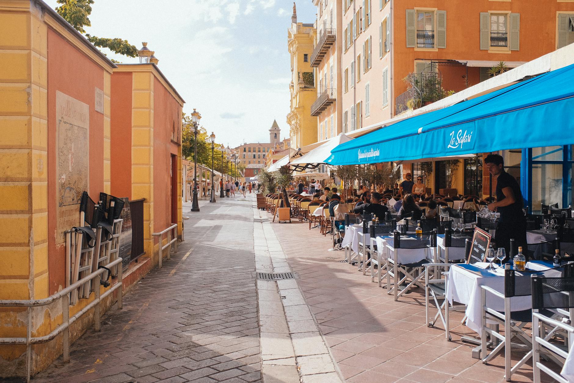 Outdoor cafe seating in Nice on a summer day