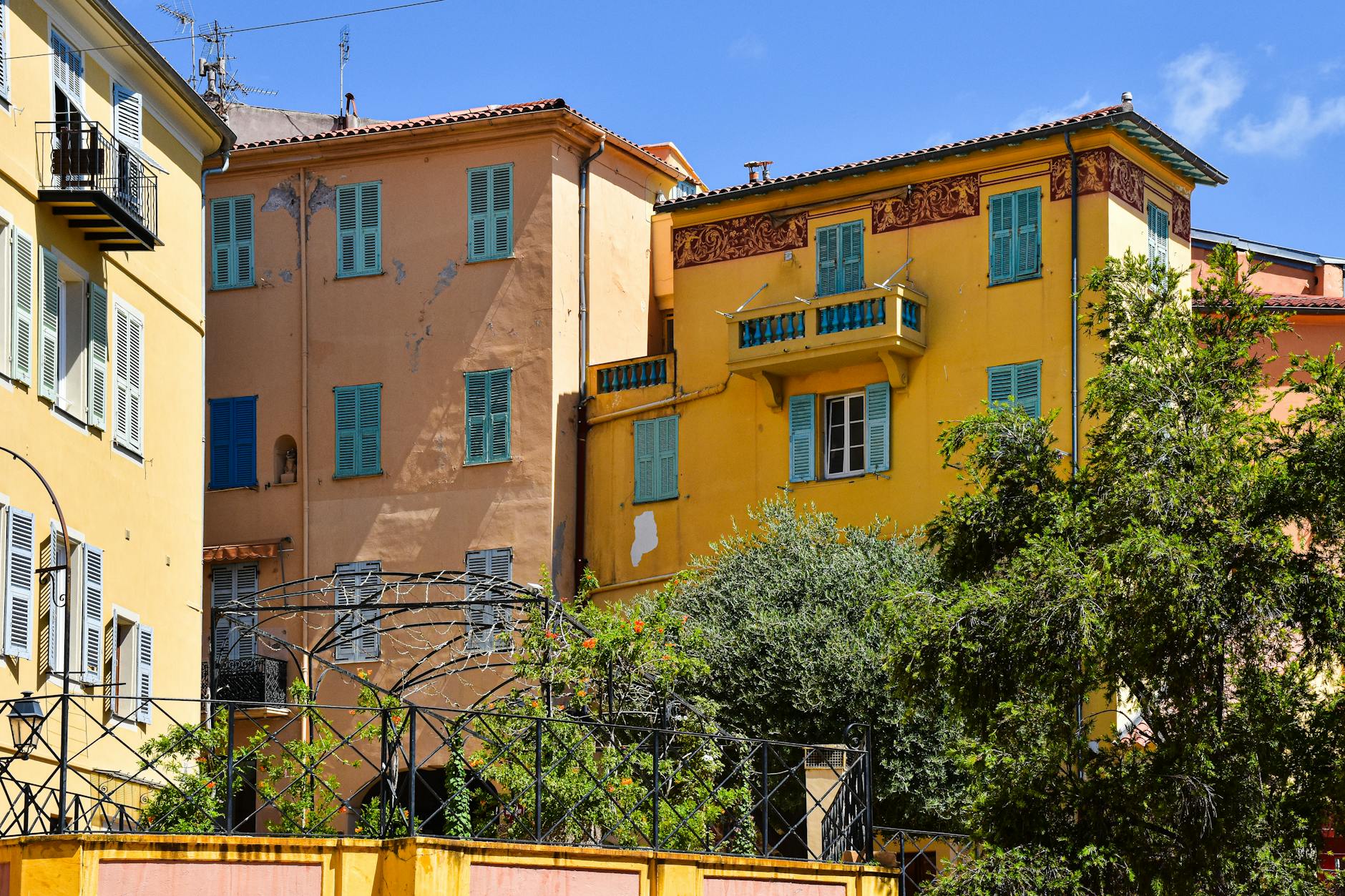 Mediterranean buildings with colorful shutters in the South of France
