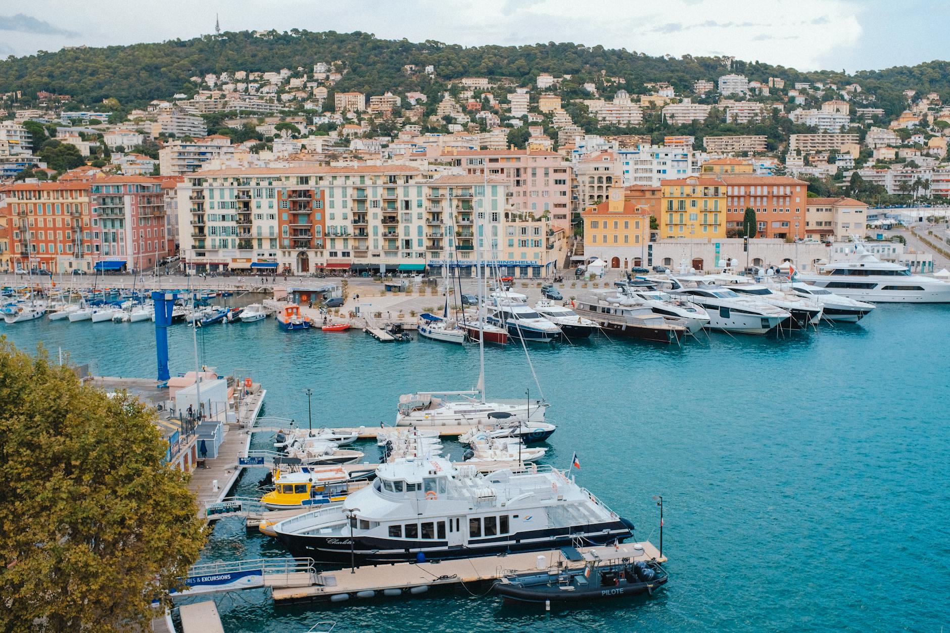 Yacht harbor in Nice with colorful Mediterranean buildings