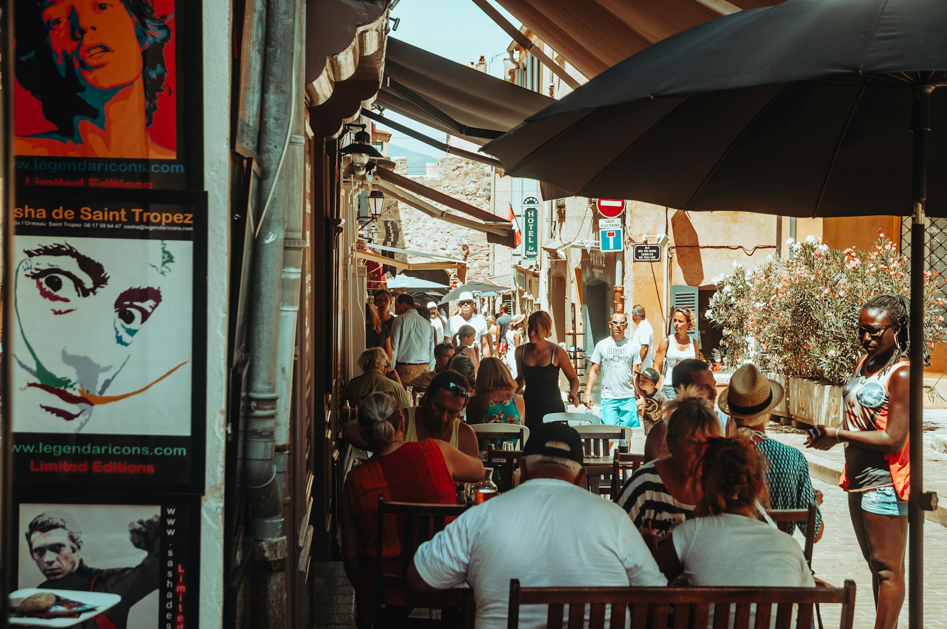 Outdoor cafe scene in the French Riviera with people dining