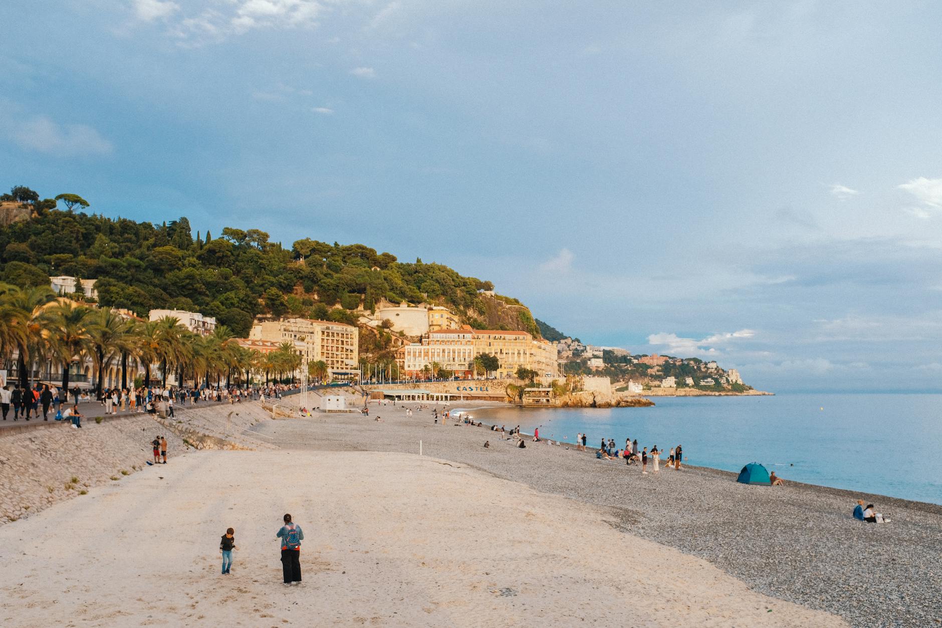 People enjoying the beach in a Mediterranean town