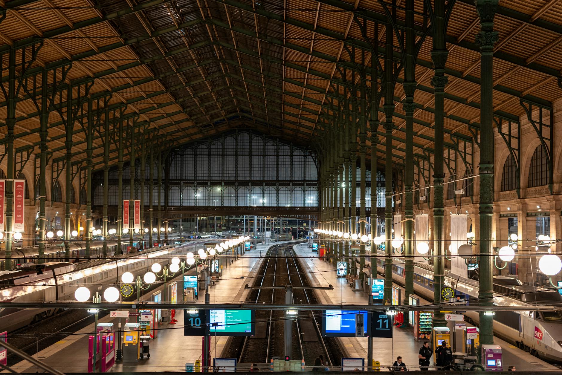 Interior of a French train station with tracks and platforms