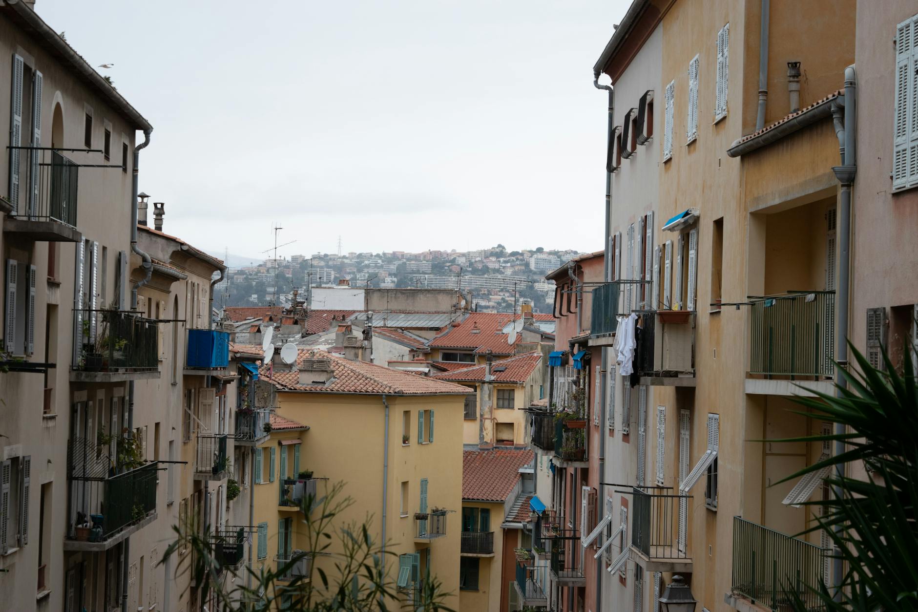 Colorful Nice streetscape with tiled roofs and historic facades