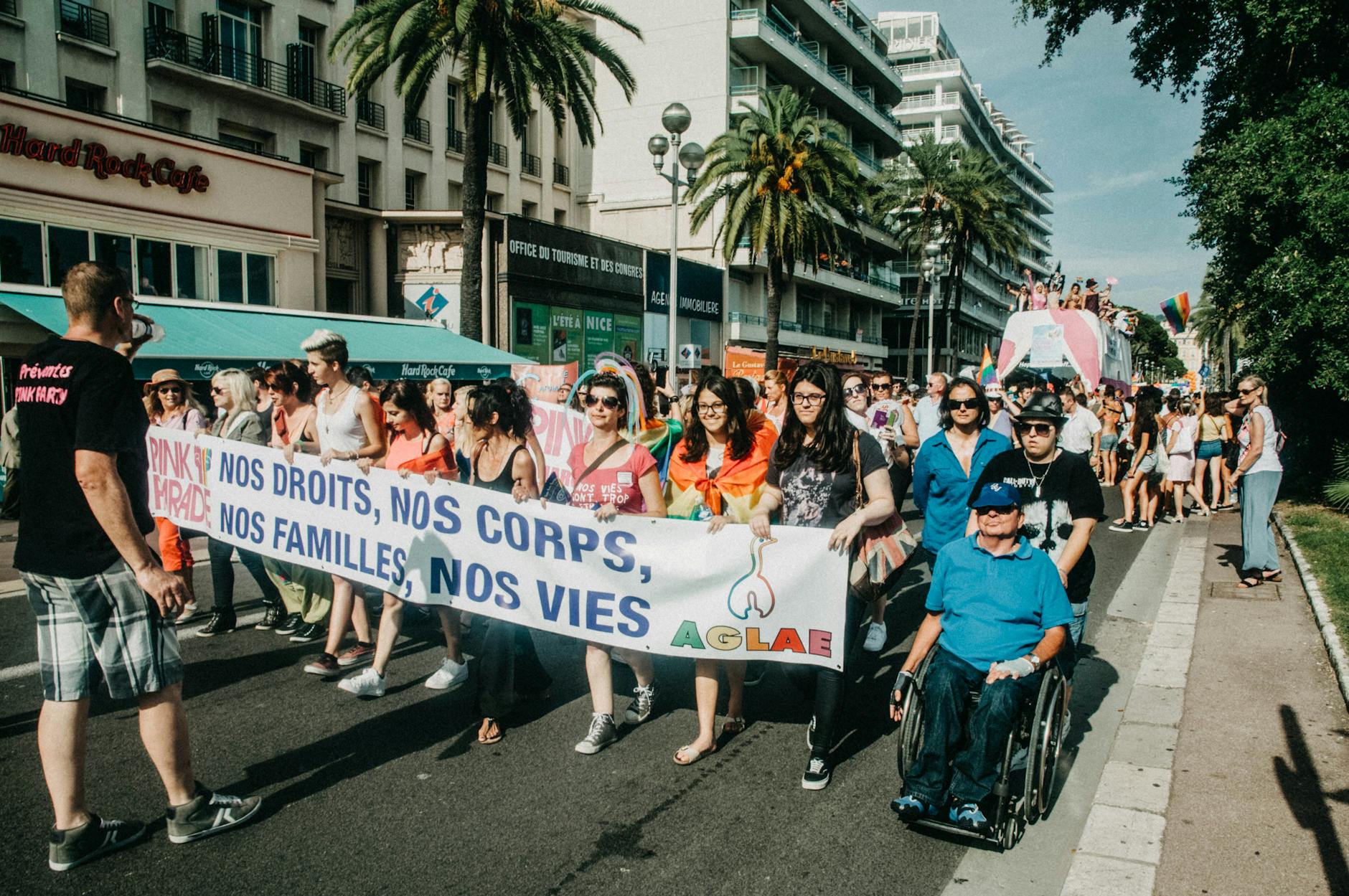 Group of people marching with a banner in a city
