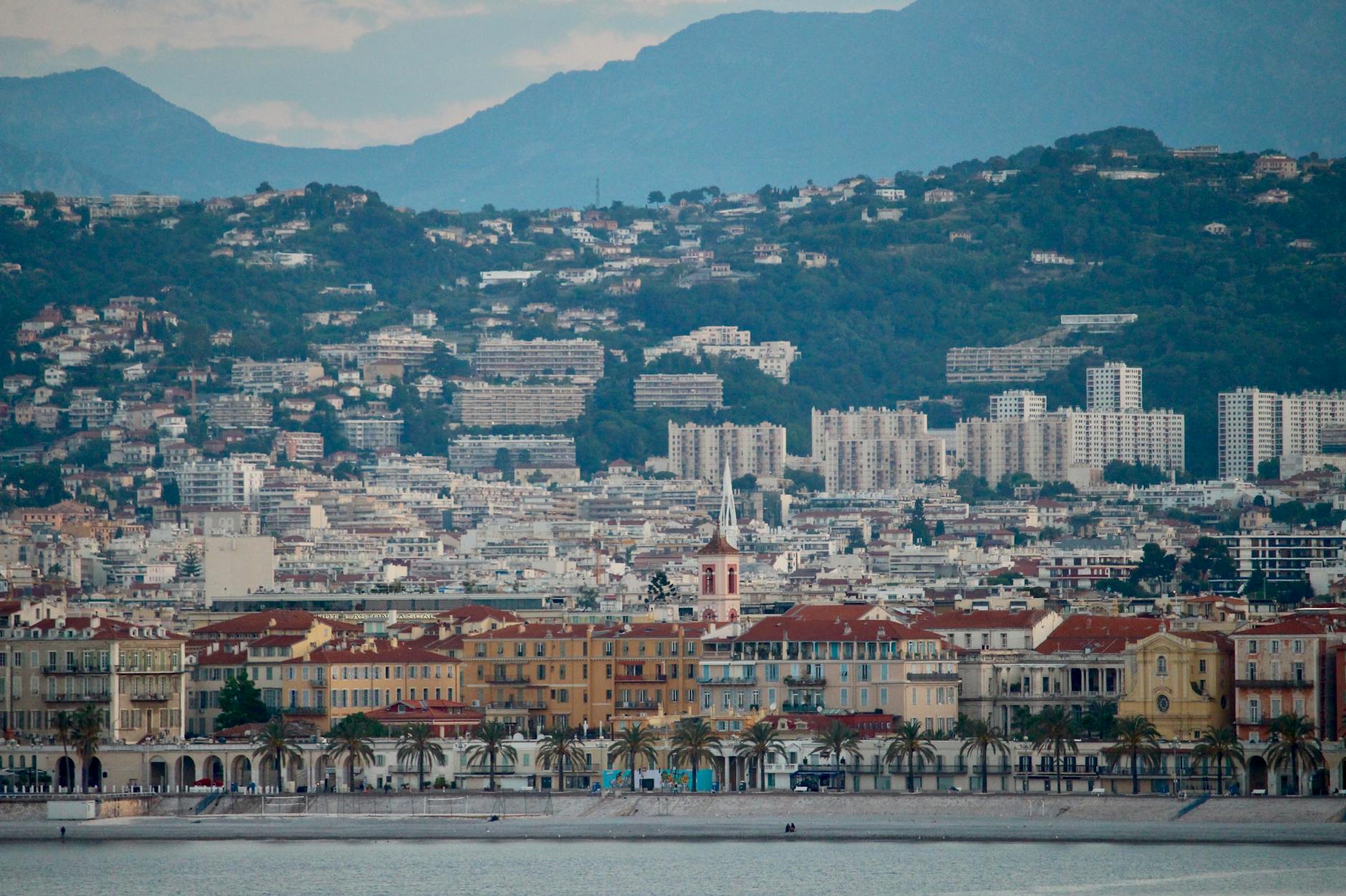 Nice urban landscape with Mediterranean architecture and mountains