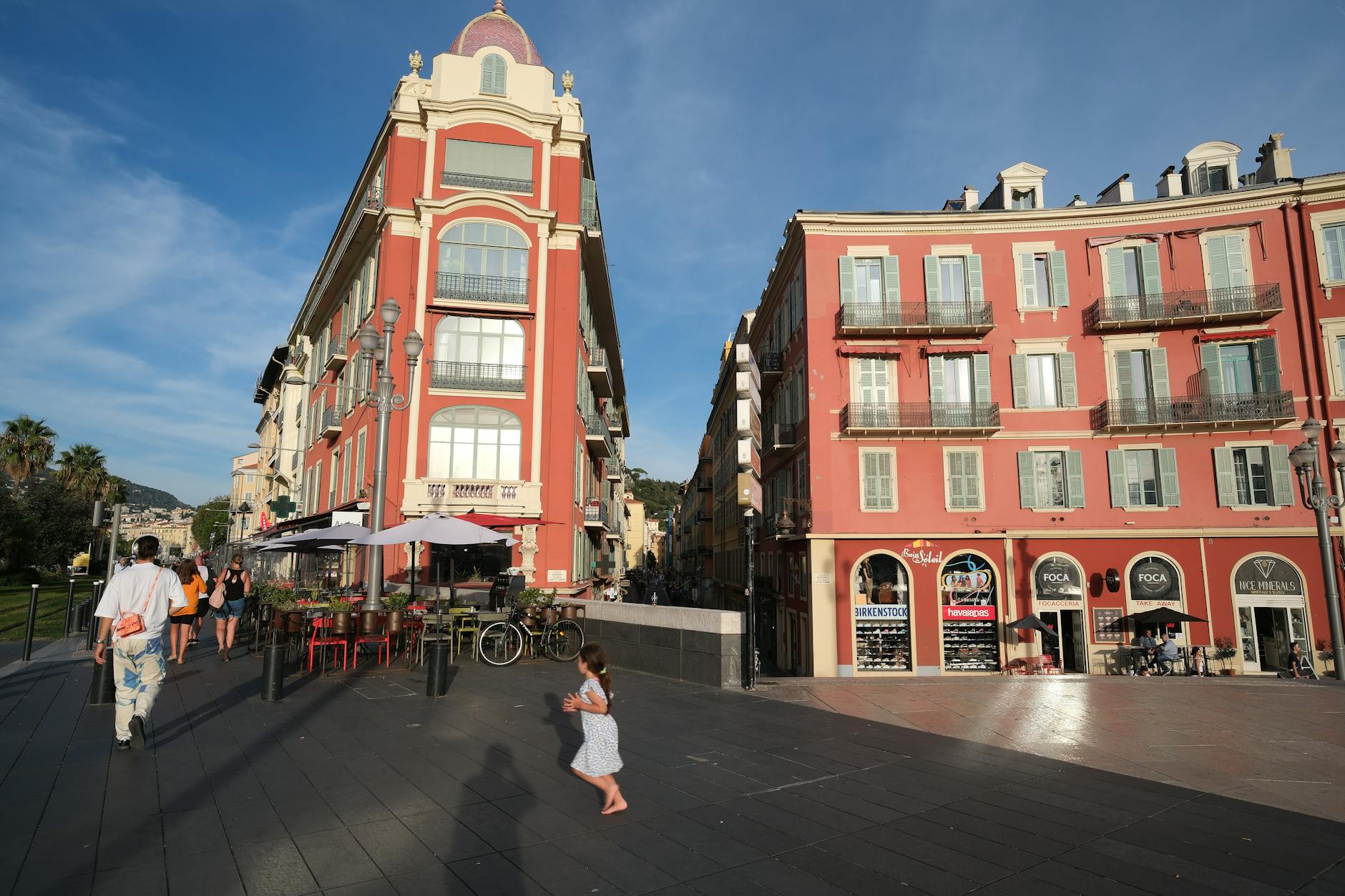 Red buildings and lively square atmosphere in Nice