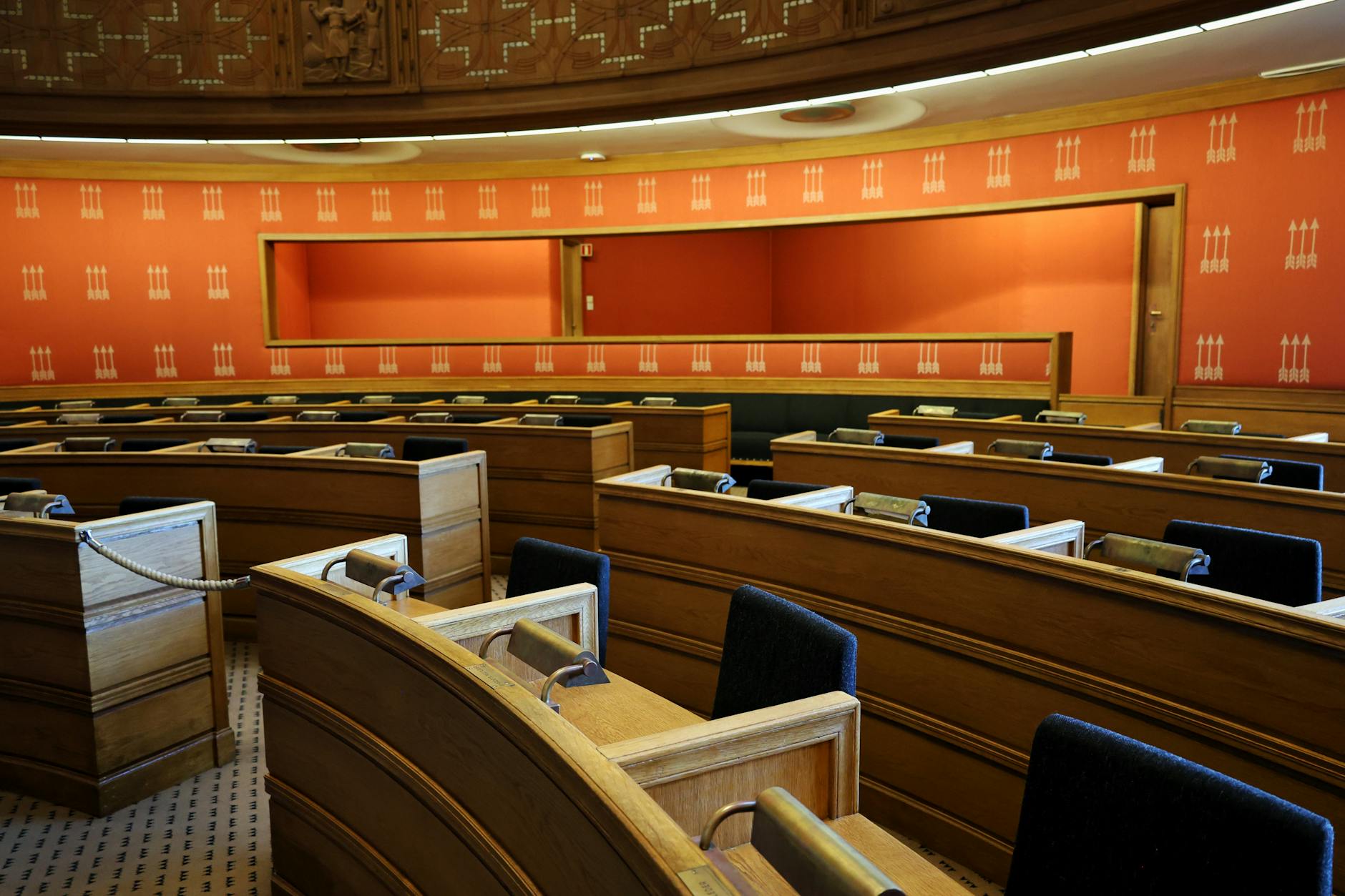 Parliamentary meeting room in Oslo with wooden seating