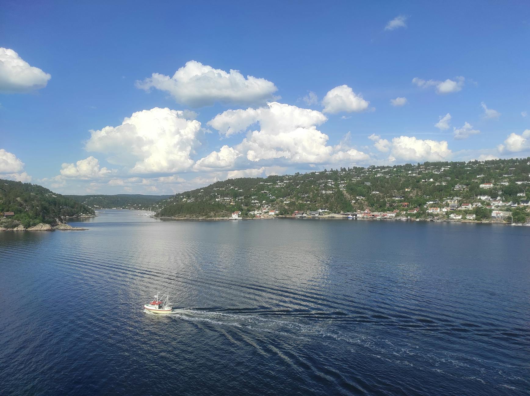 Oslofjord with lone boat and scenic hills