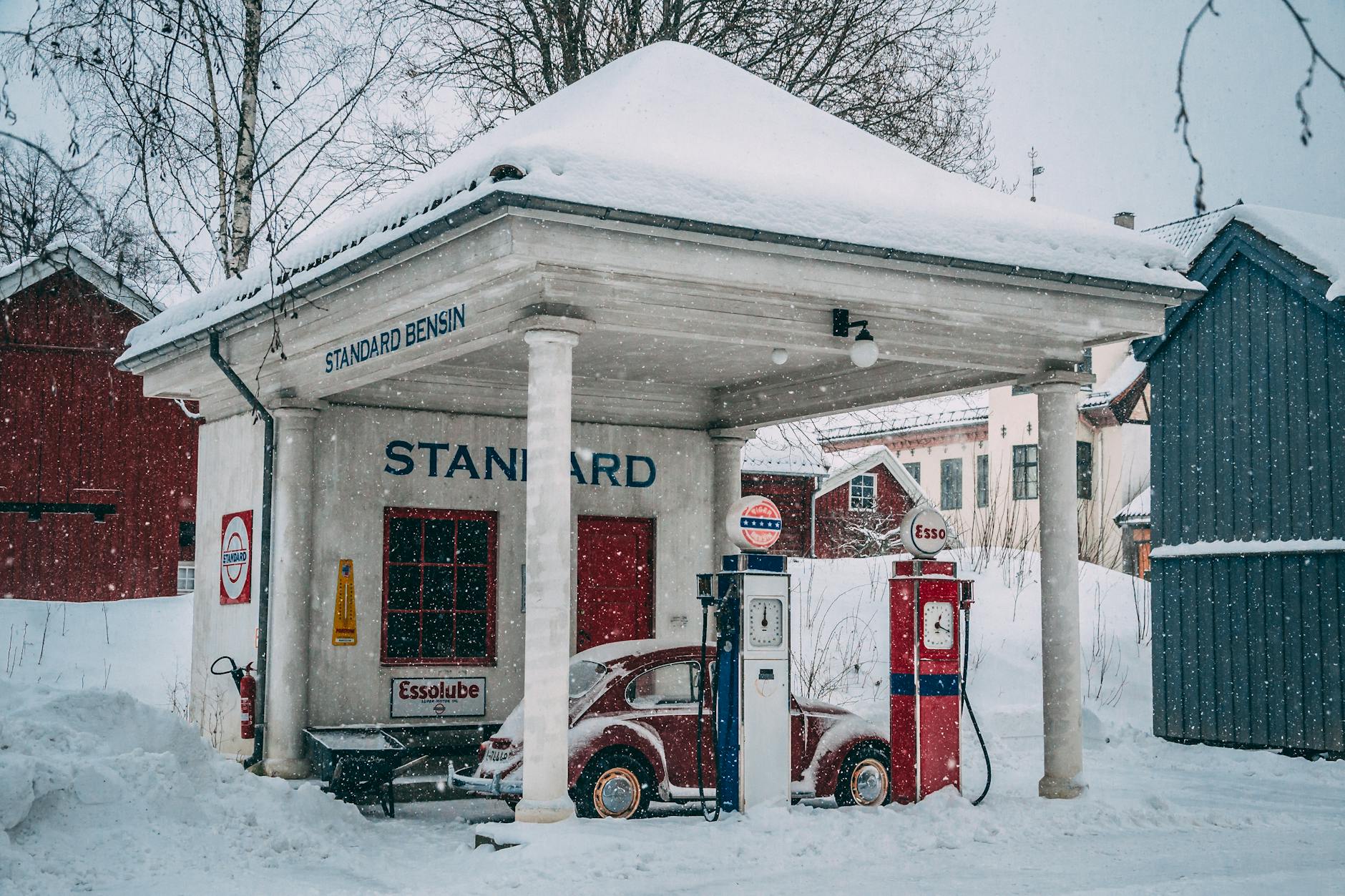 Snow-covered vintage gas station in Oslo