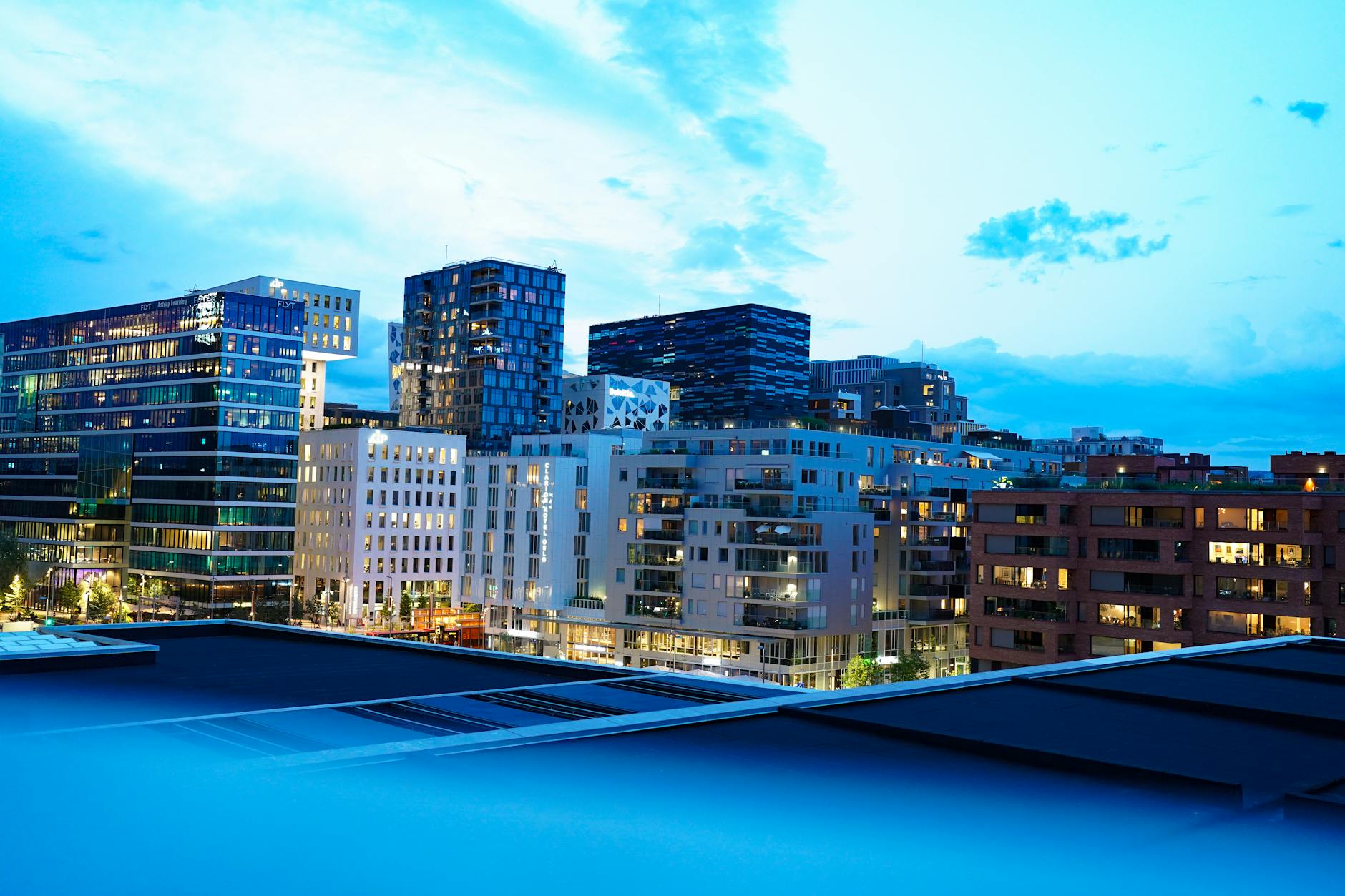Modern buildings in Oslo downtown illuminated at twilight