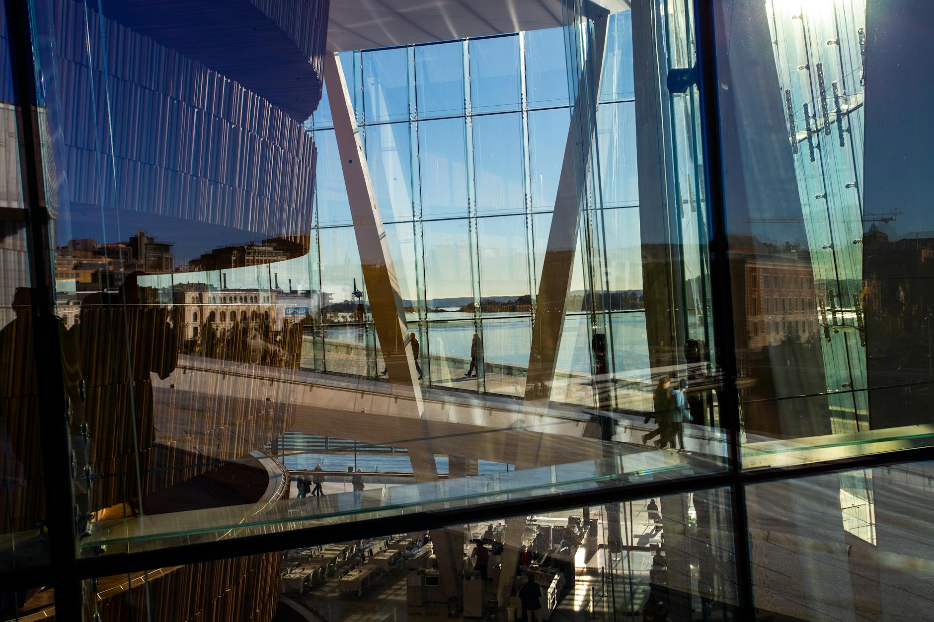 View through Oslo Opera House glass with city reflections